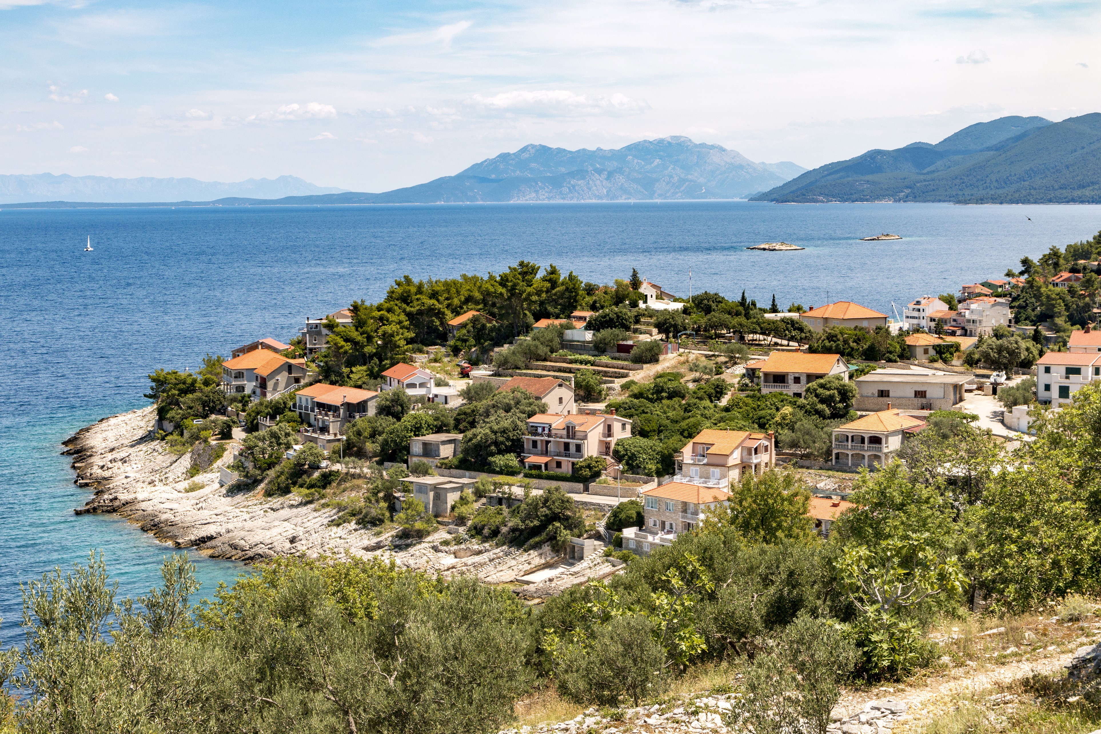 Houses on the coast of Prigradica, Croatia by the sea HD Wallpaper