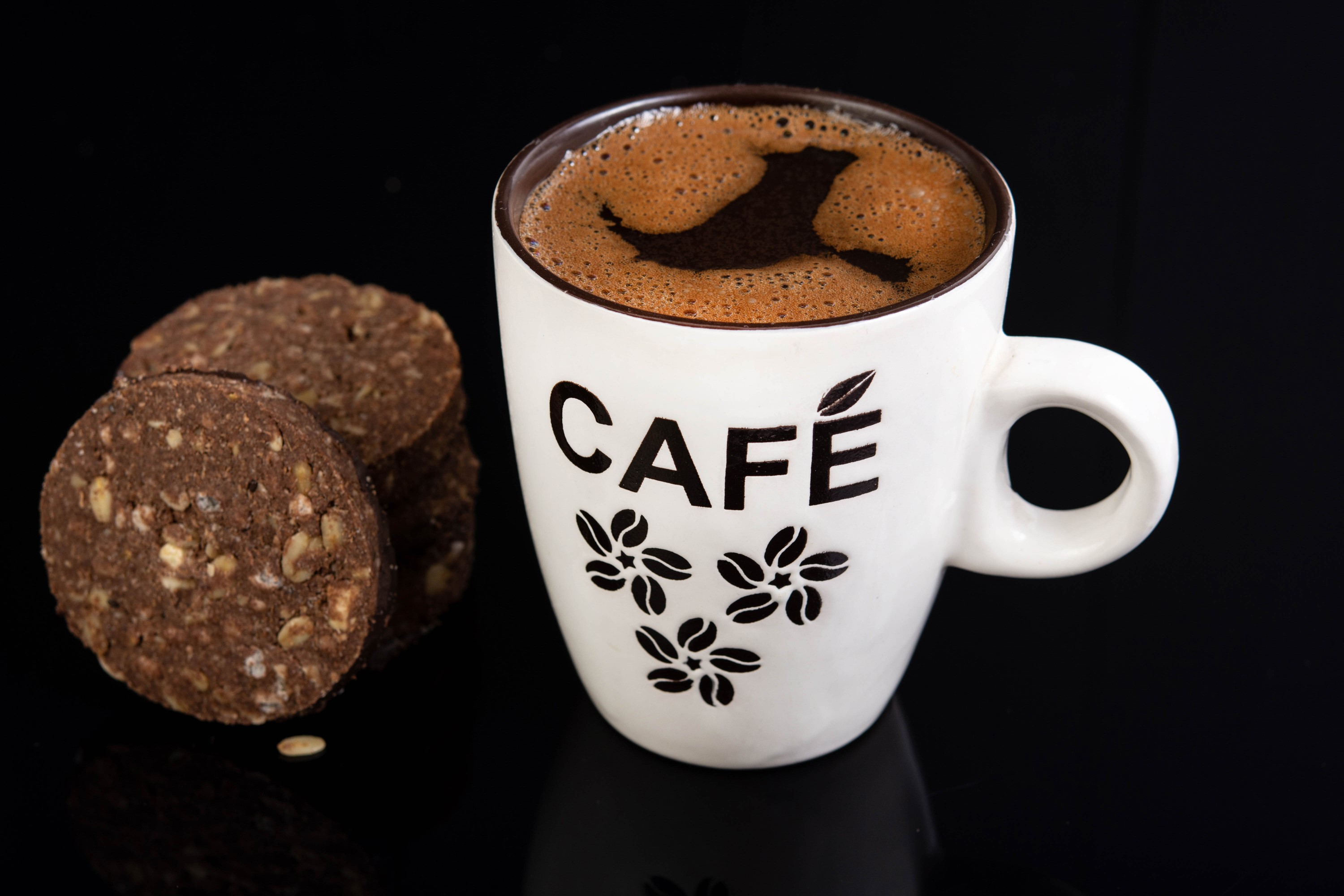 Coffee cup with cookies on black background HD Wallpaper