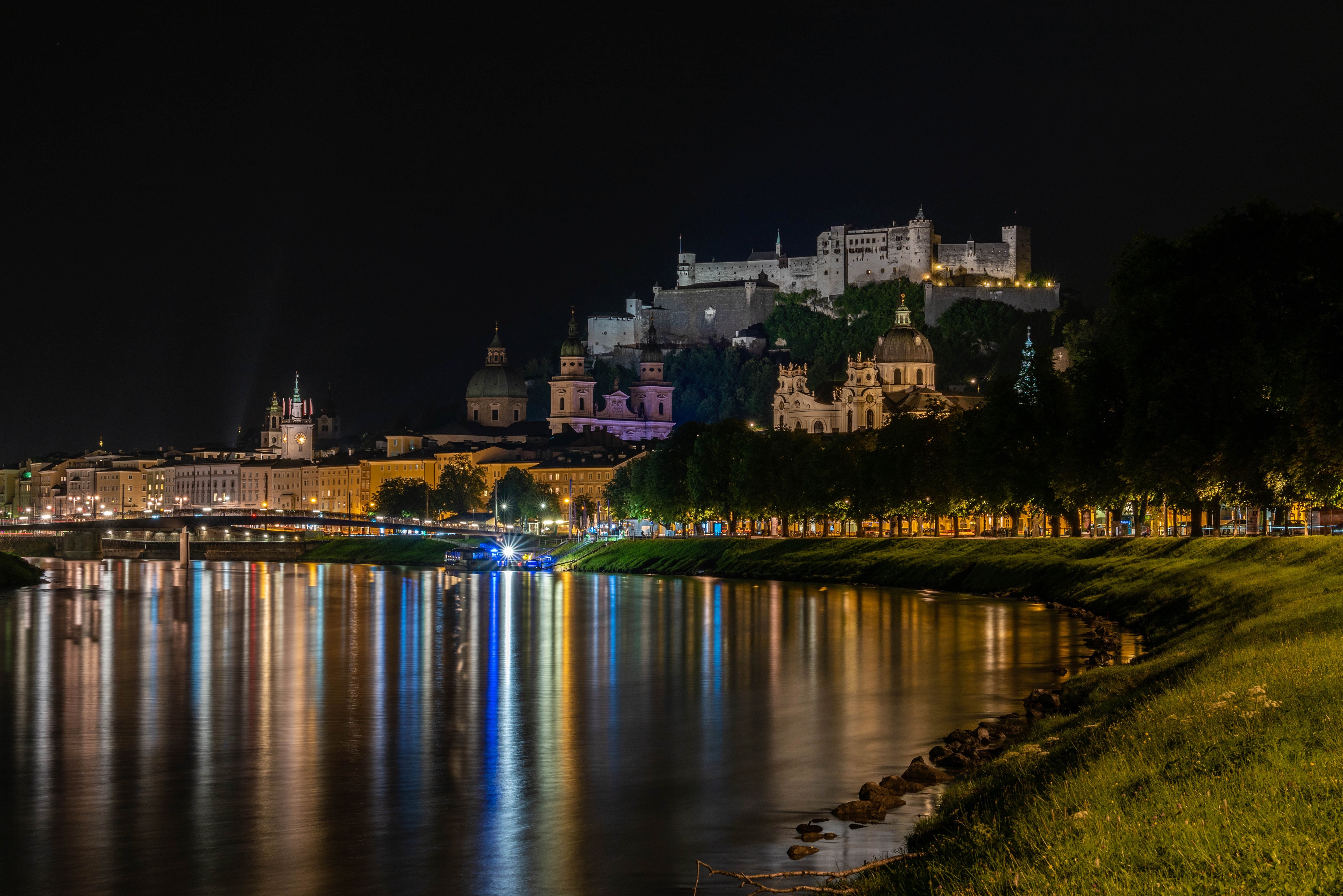 Salzburg at night with river reflections HD Wallpaper