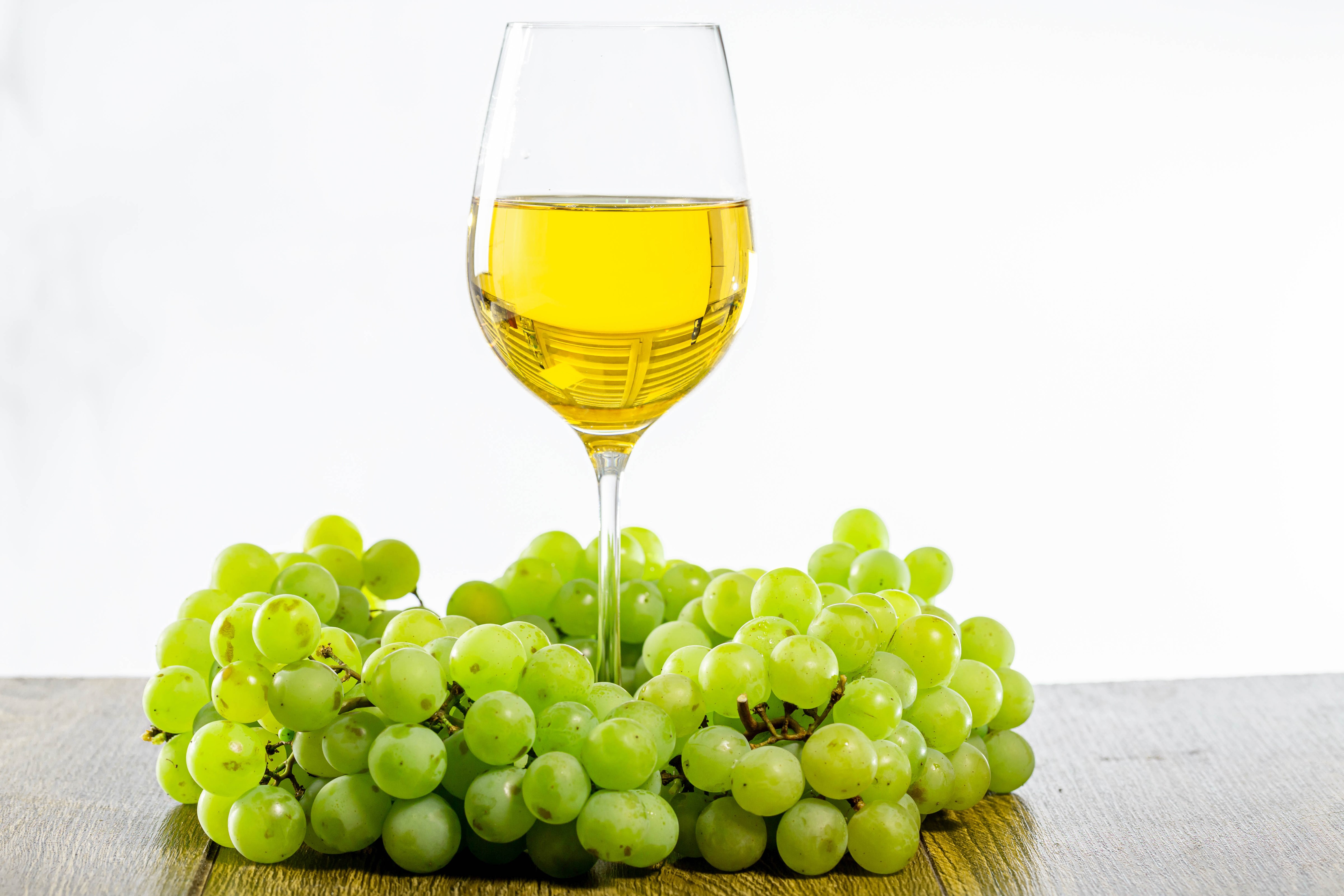 White Wine in a Glass with Green Grapes HD Wallpaper