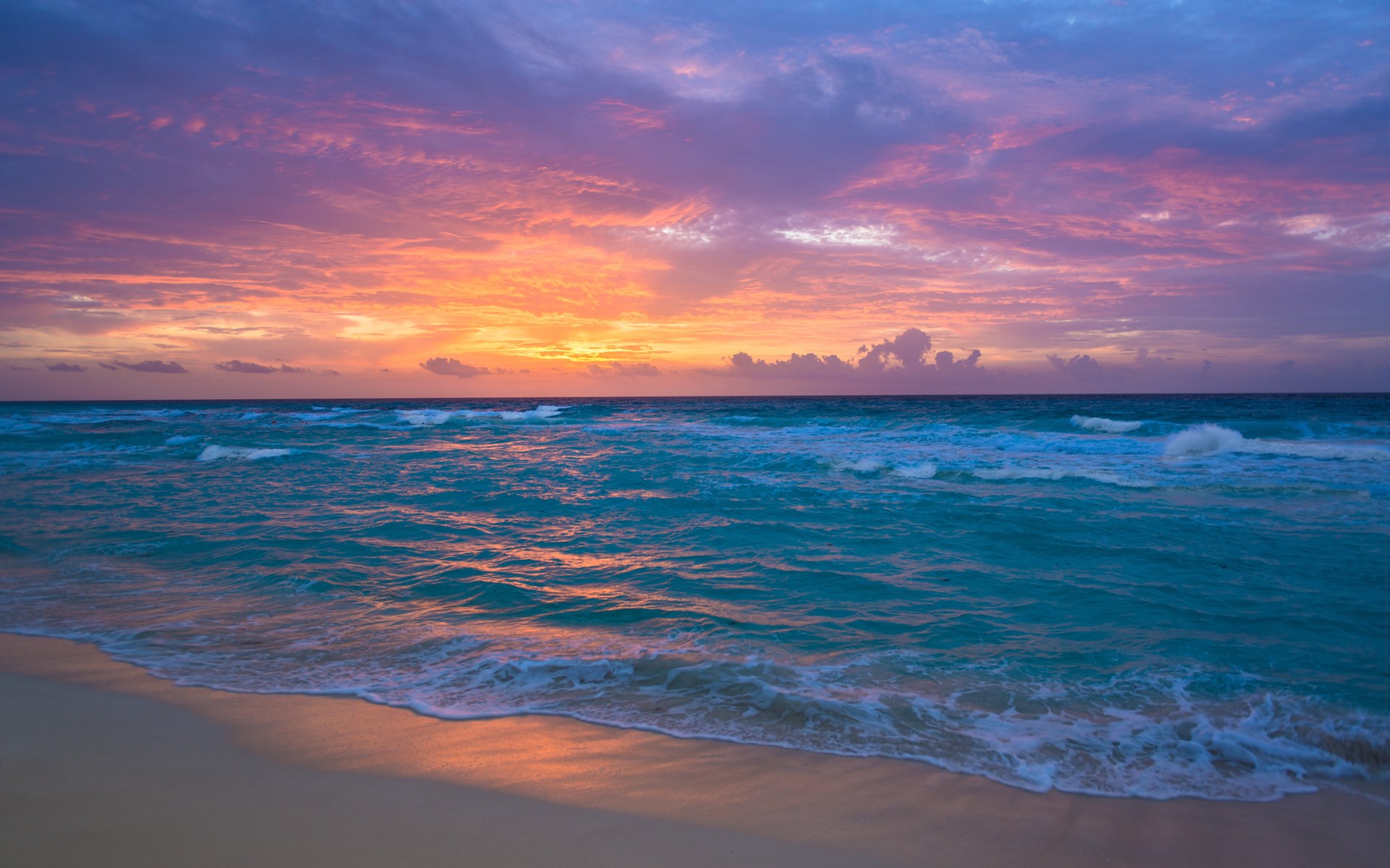 Ocean waves at sunset with colorful sky HD Wallpaper