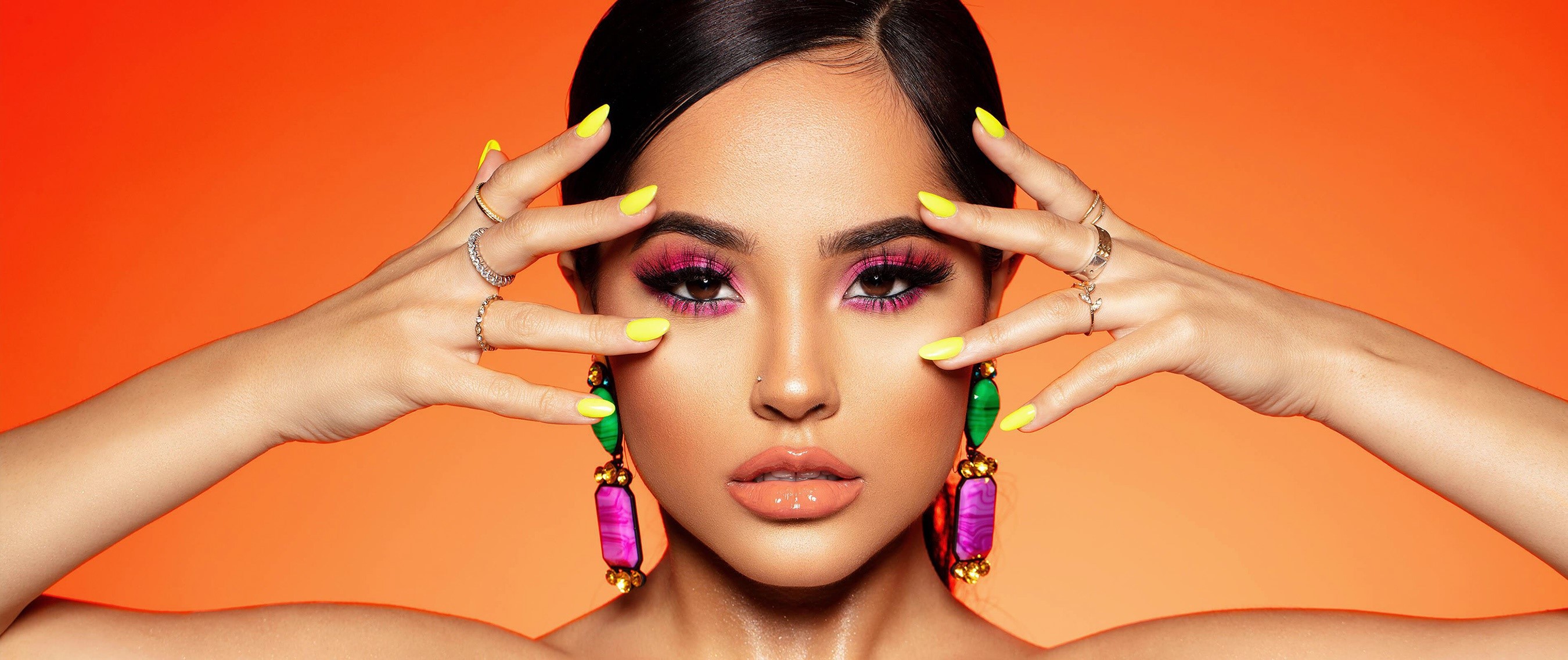 Becky G with bright makeup and yellow nails HD Wallpaper