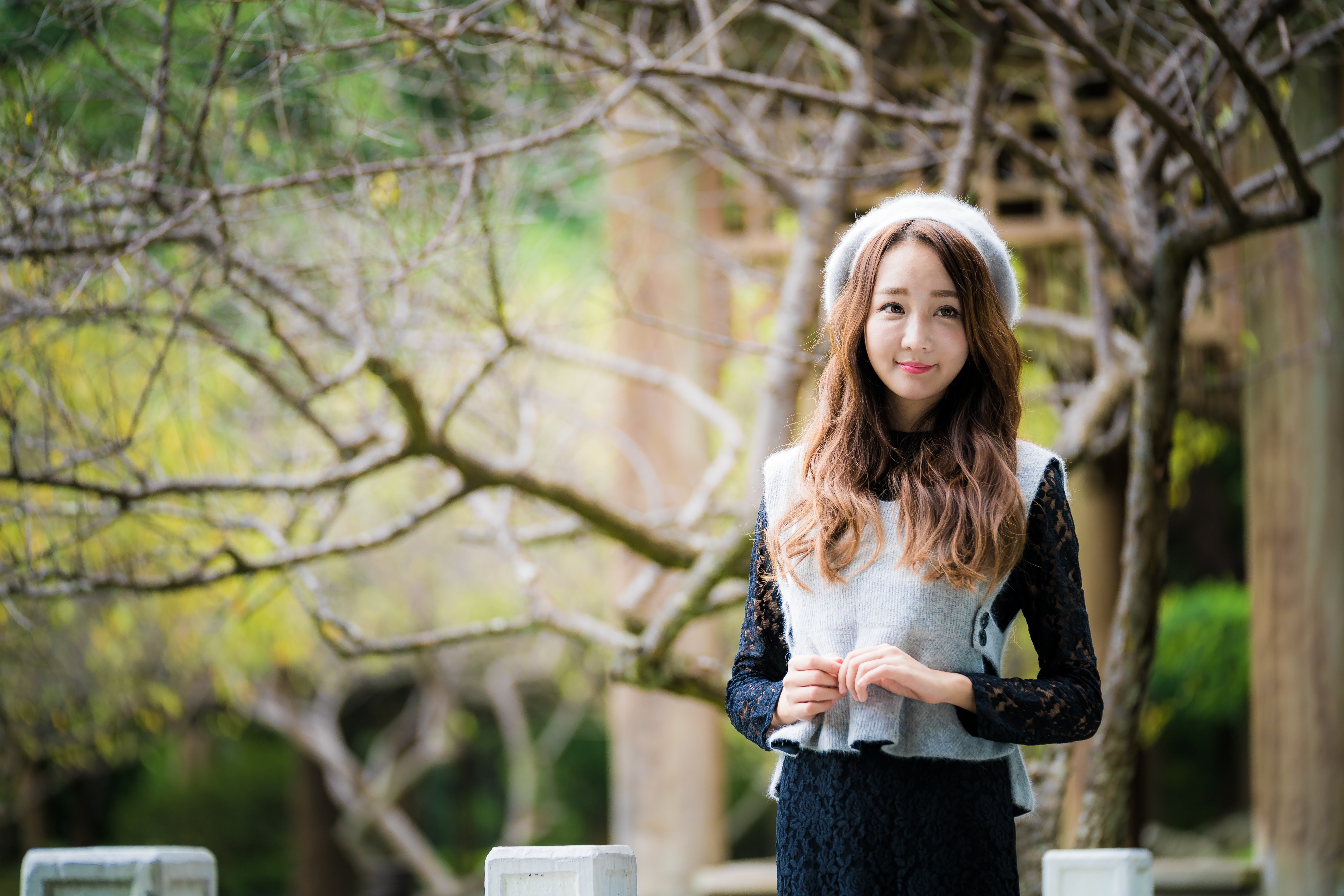 Asian woman with brown hair wearing a hat and vest HD Wallpaper