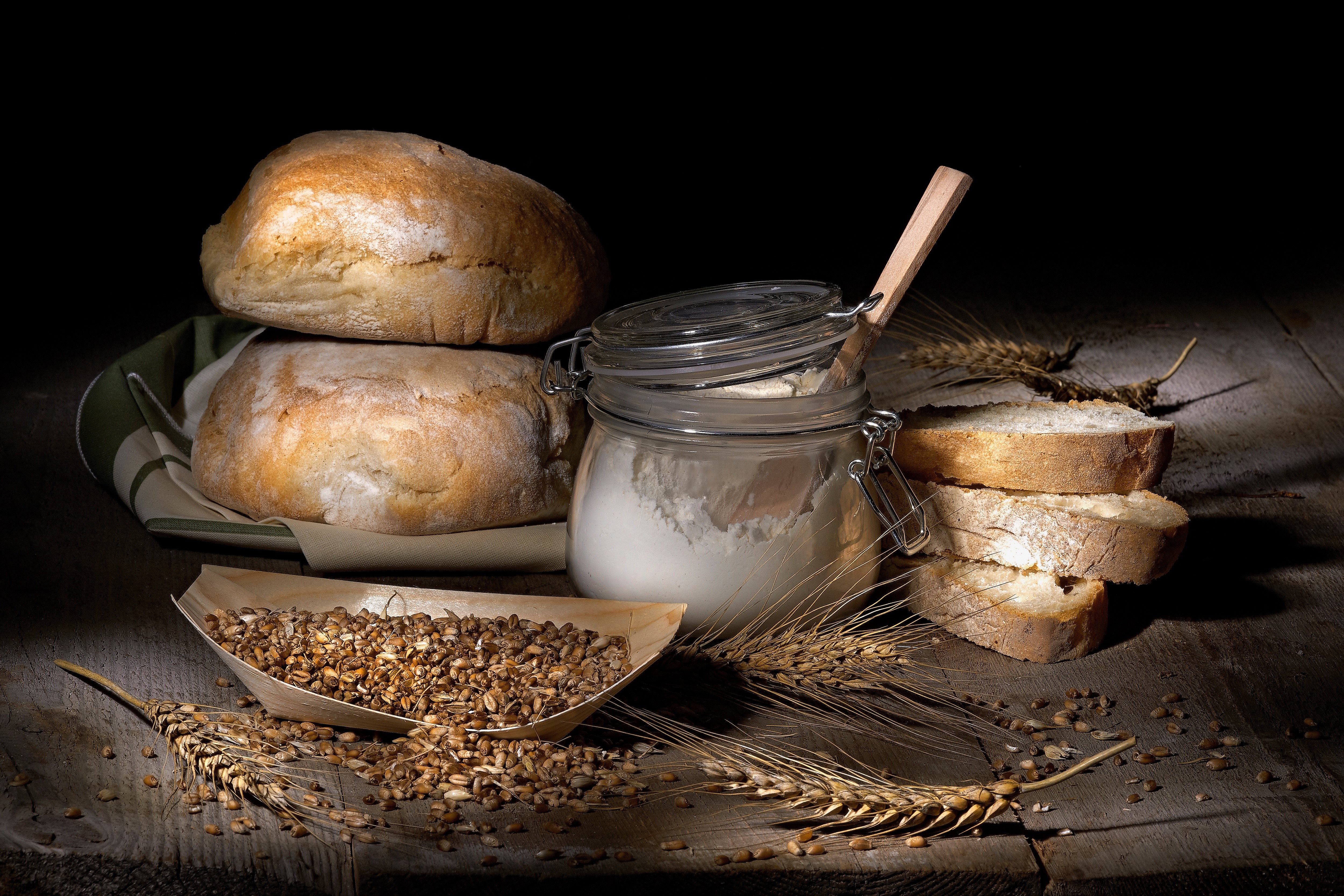 Bread, Flour, Wheat, and Grain on a Wooden Table HD Wallpaper