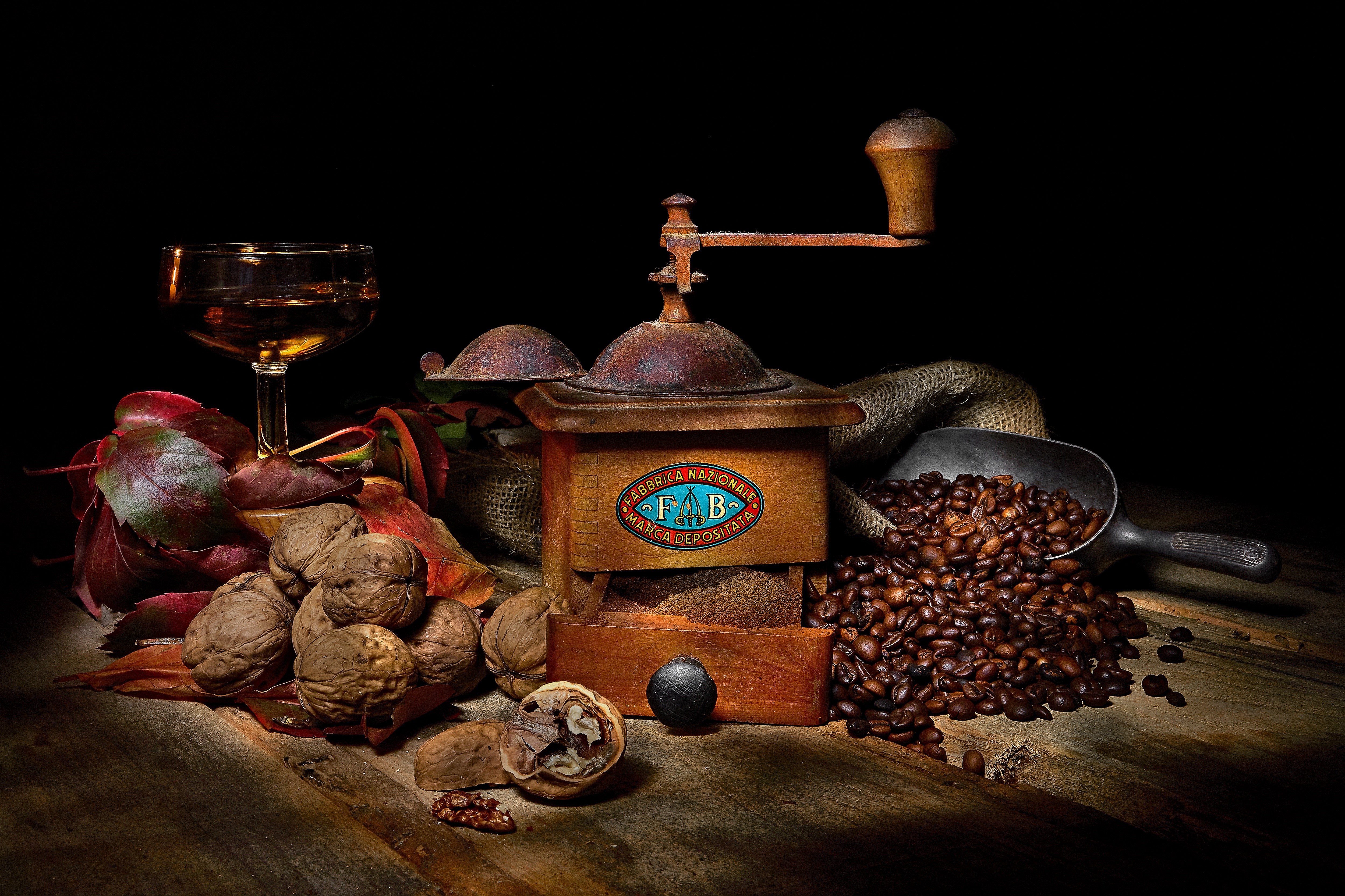 Coffee beans, walnuts, and a vintage coffee mill HD Wallpaper