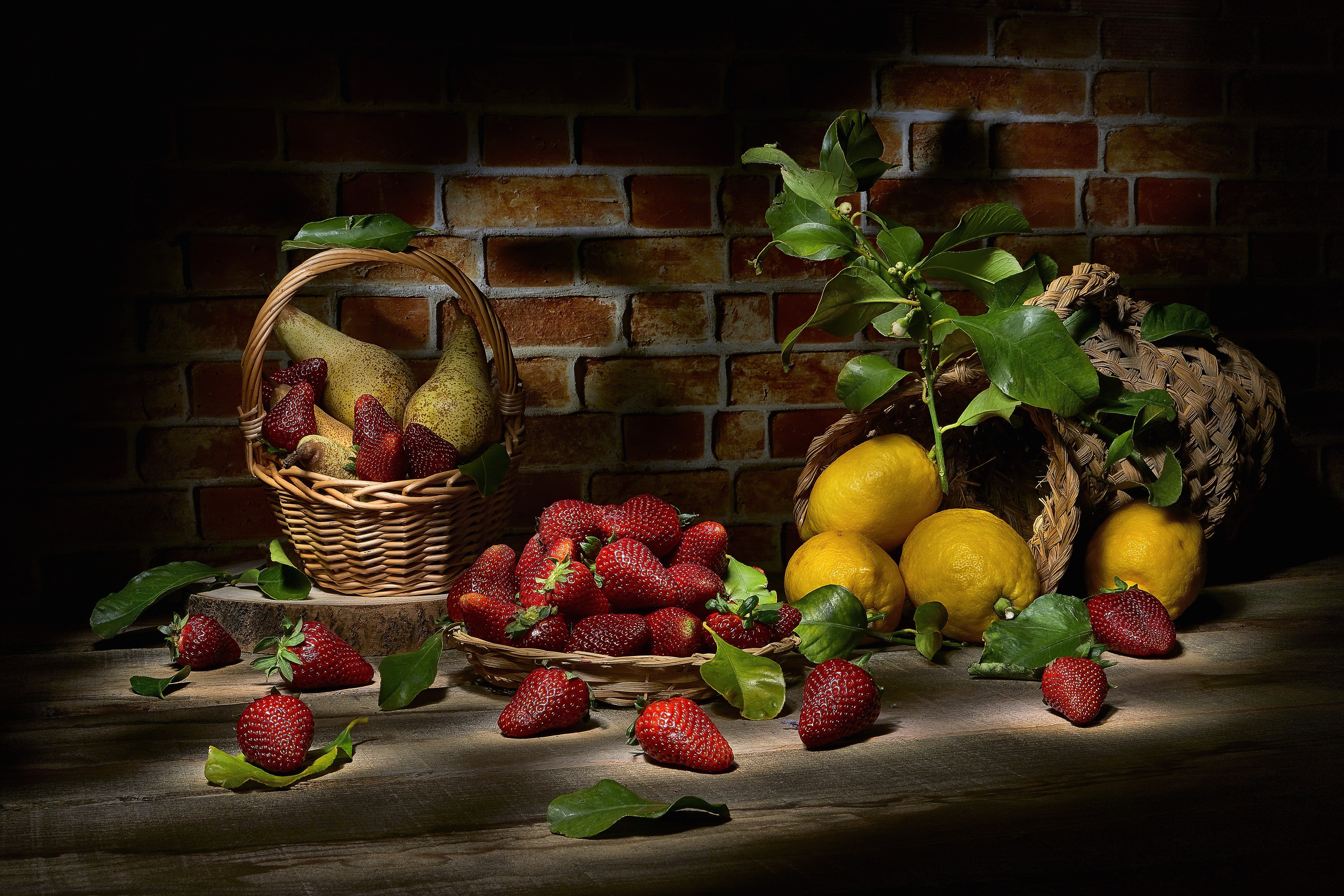 Still-life with strawberries, lemons, and pears in wicker baskets HD Wallpaper