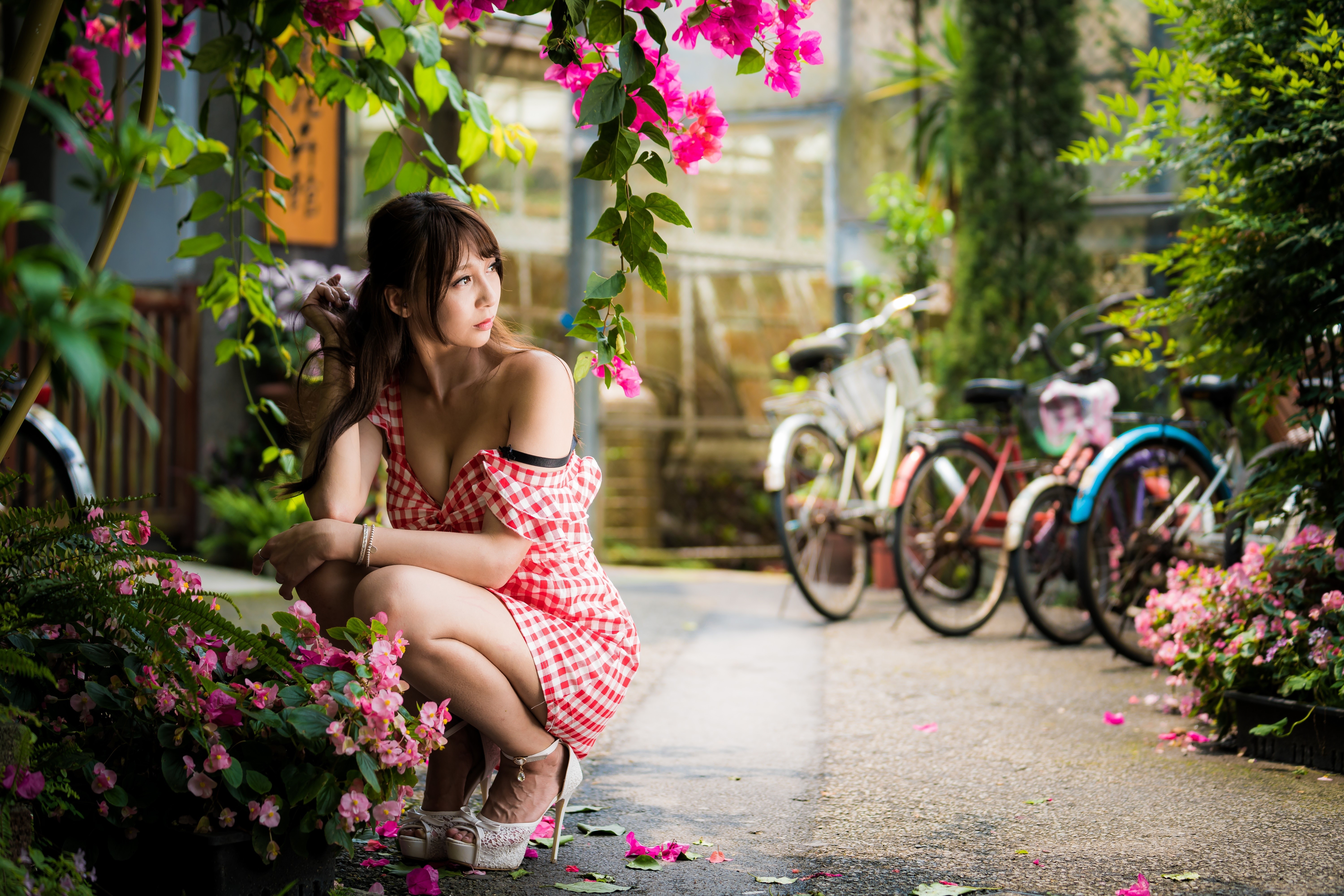 Asian Woman in Red Dress Sitting Amid Pink Flowers 4K HD Wallpaper