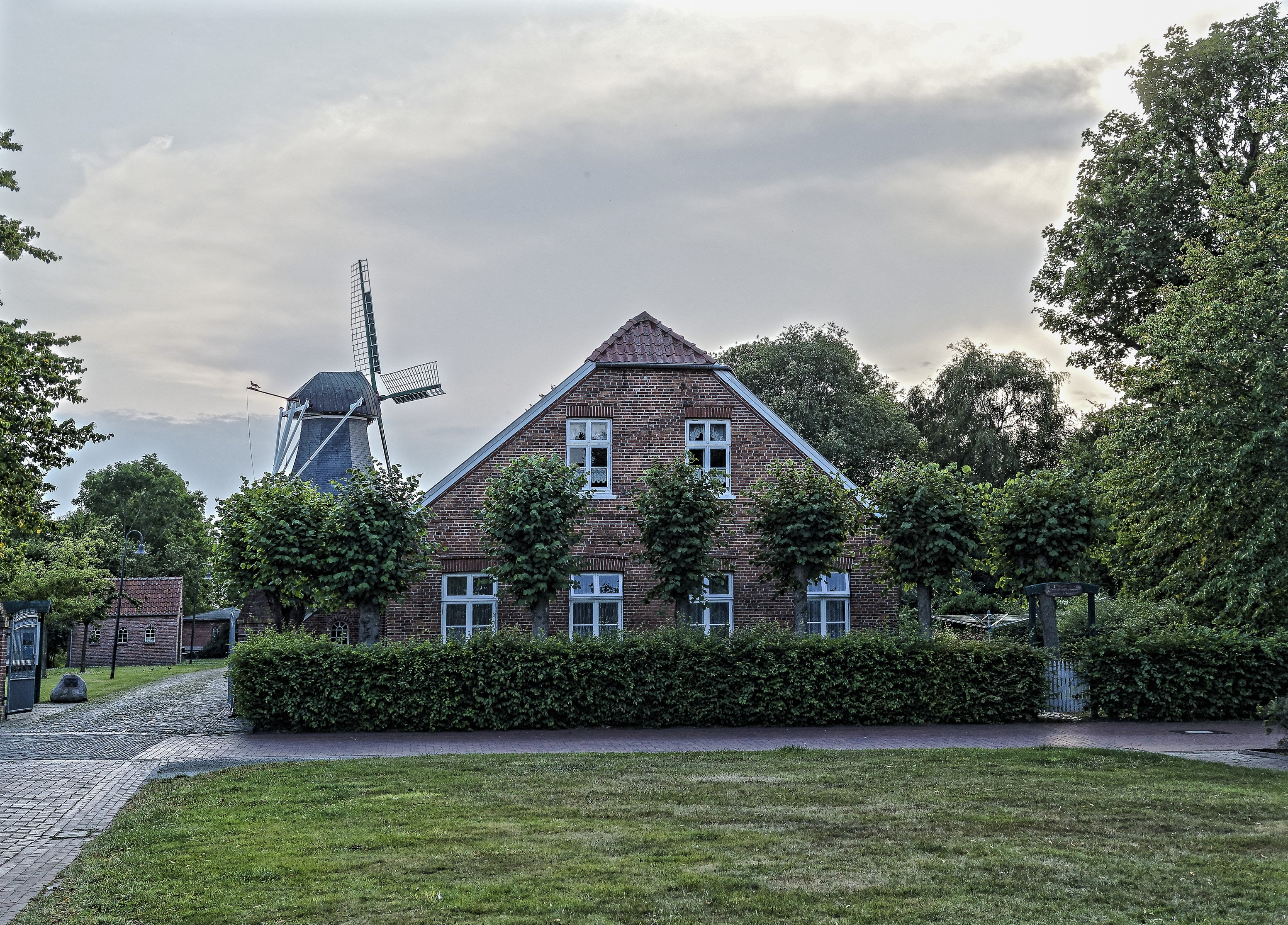 Brick house and windmill in Leezdorf, Germany HD Wallpaper