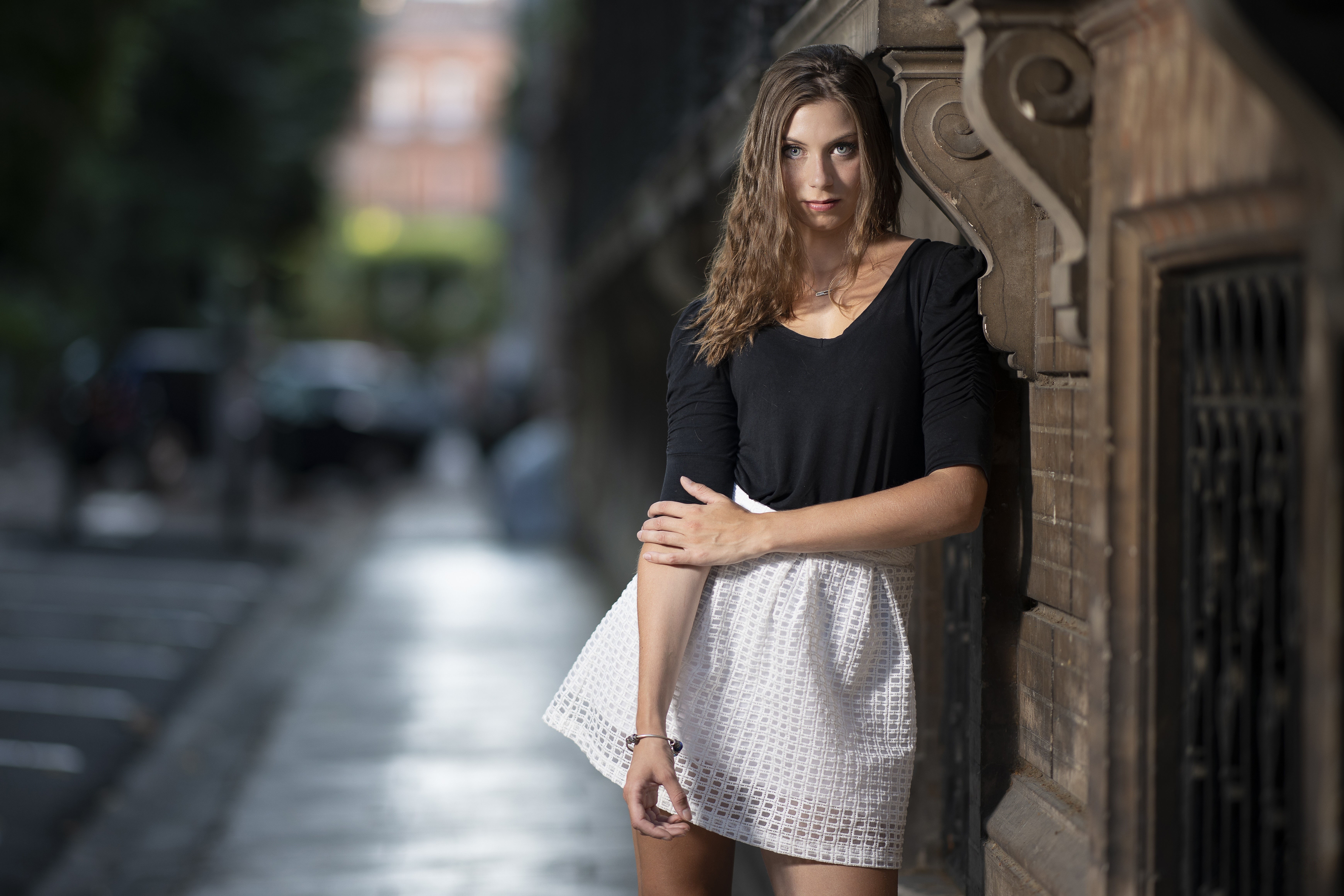 Tiffanie, a brown-haired model in a skirt, poses. HD Wallpaper