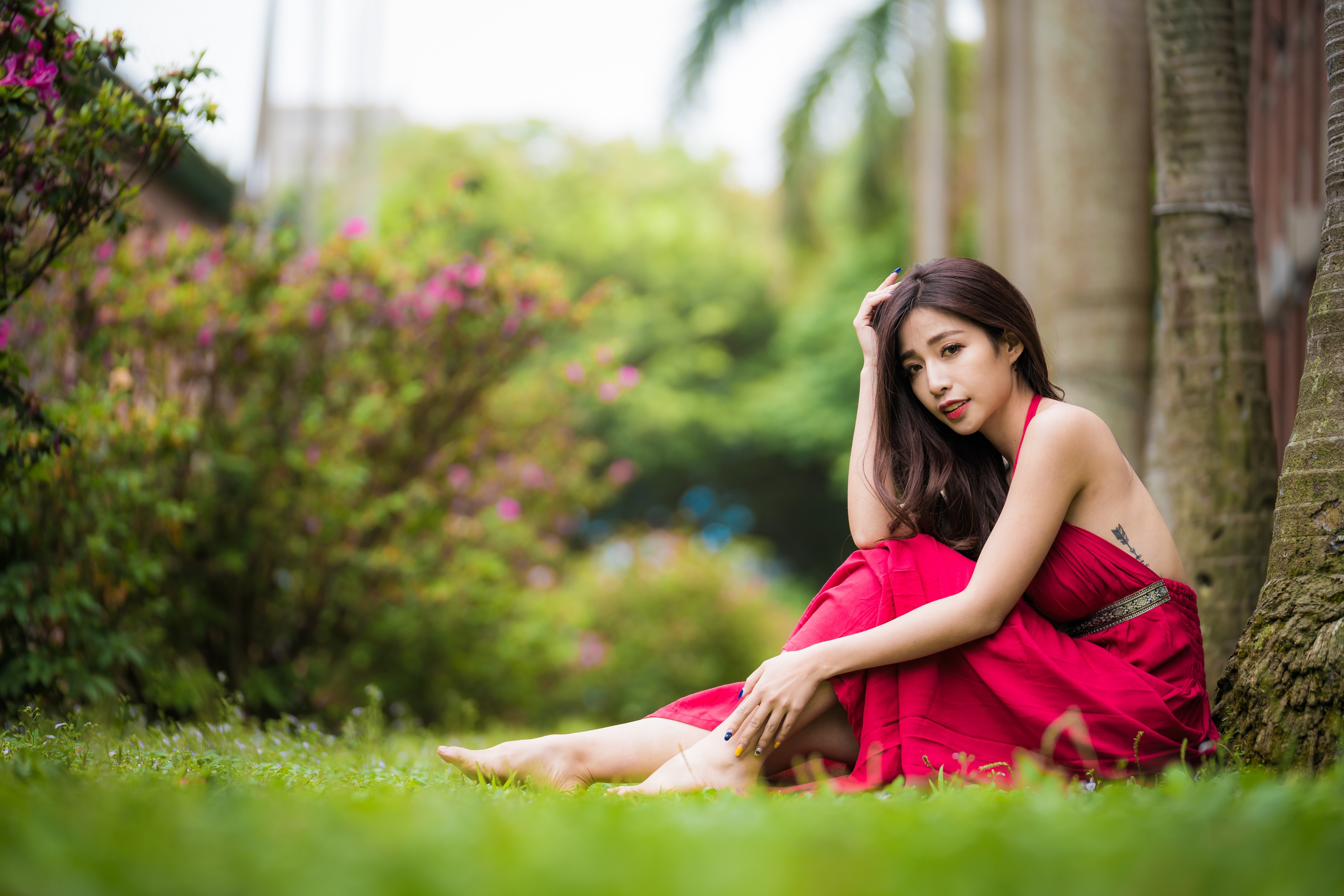 4K Sitting Woman in Red Dress with Bokeh Background HD Wallpaper
