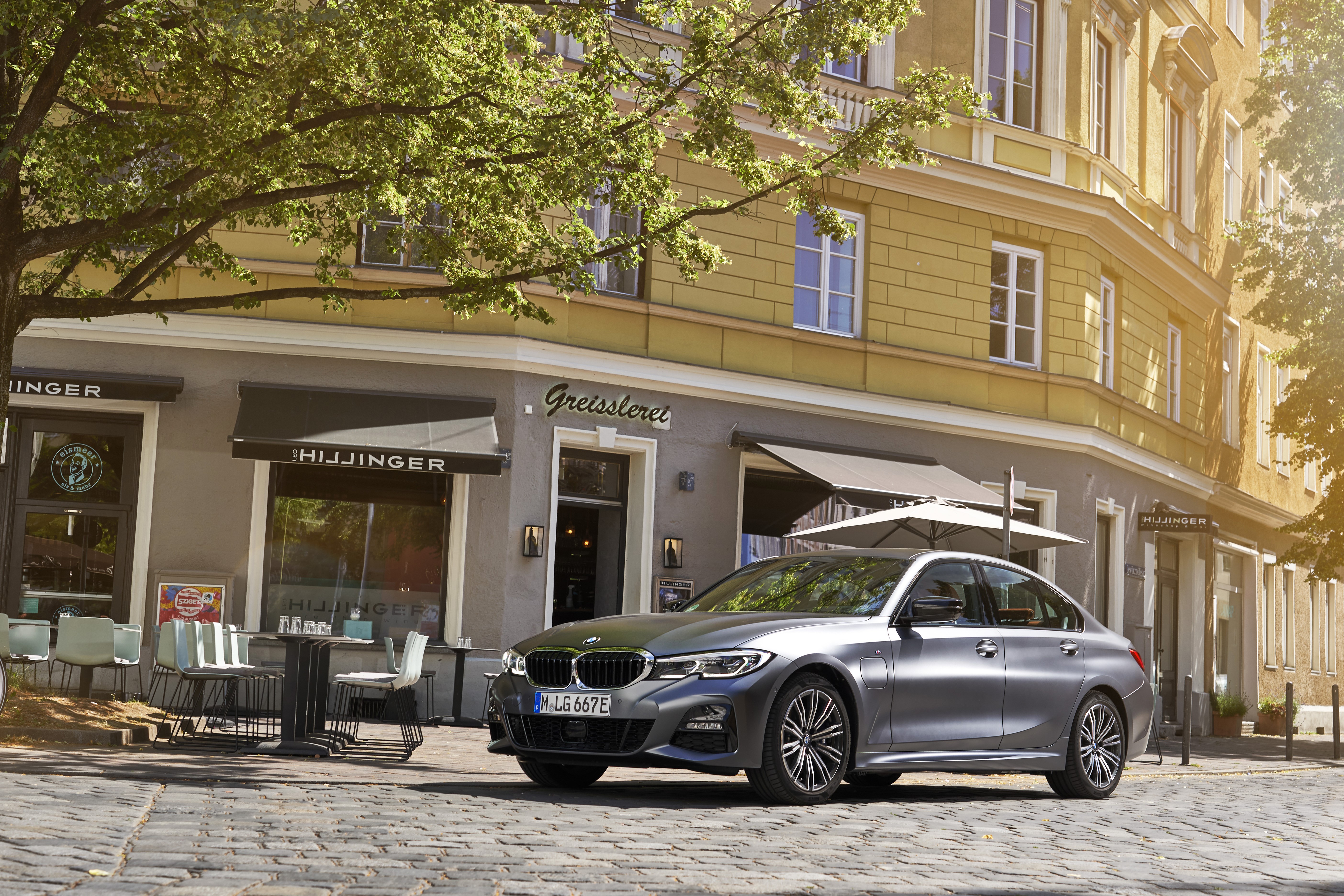 BMW 330e M Sport Sedan on Cobblestone Street HD Wallpaper