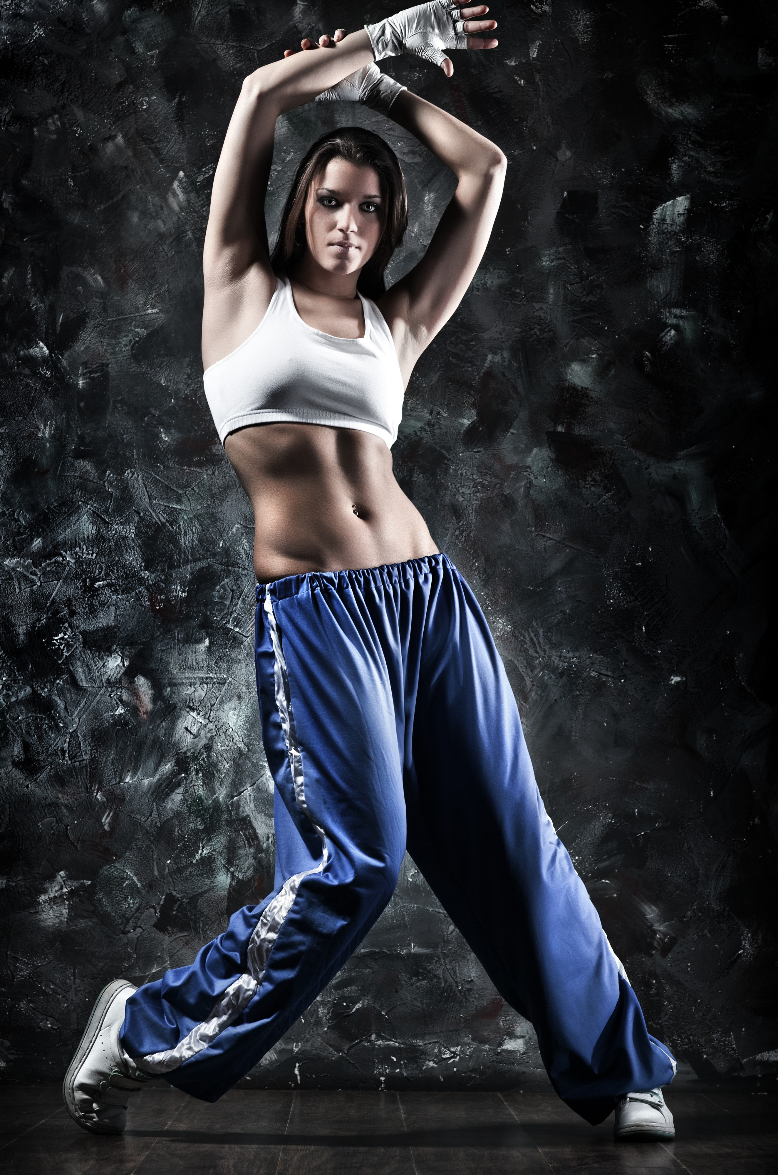 Woman in white top and blue pants dancing HD Phone Wallpaper