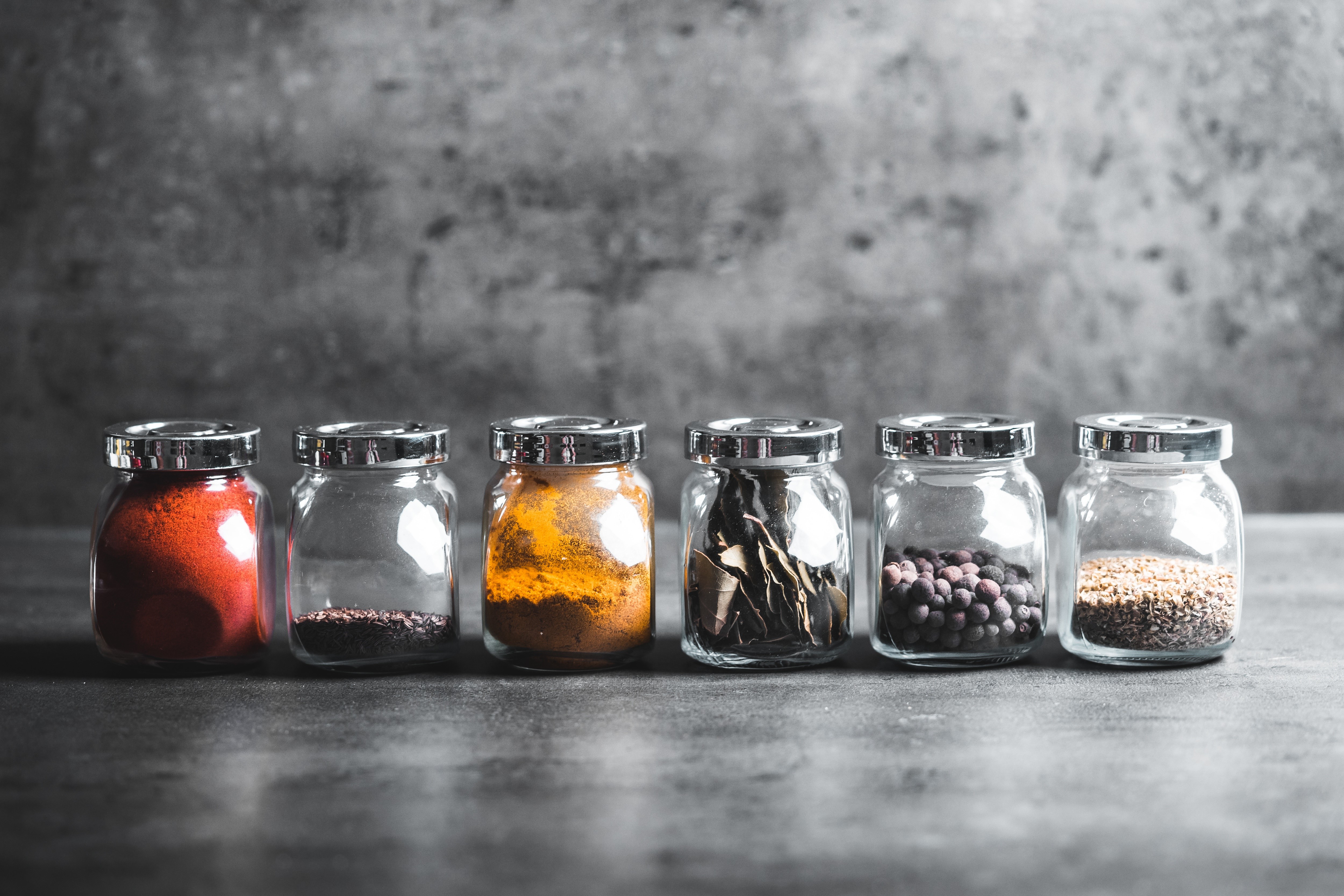 Jars of Spices on a Dark Surface HD Wallpaper