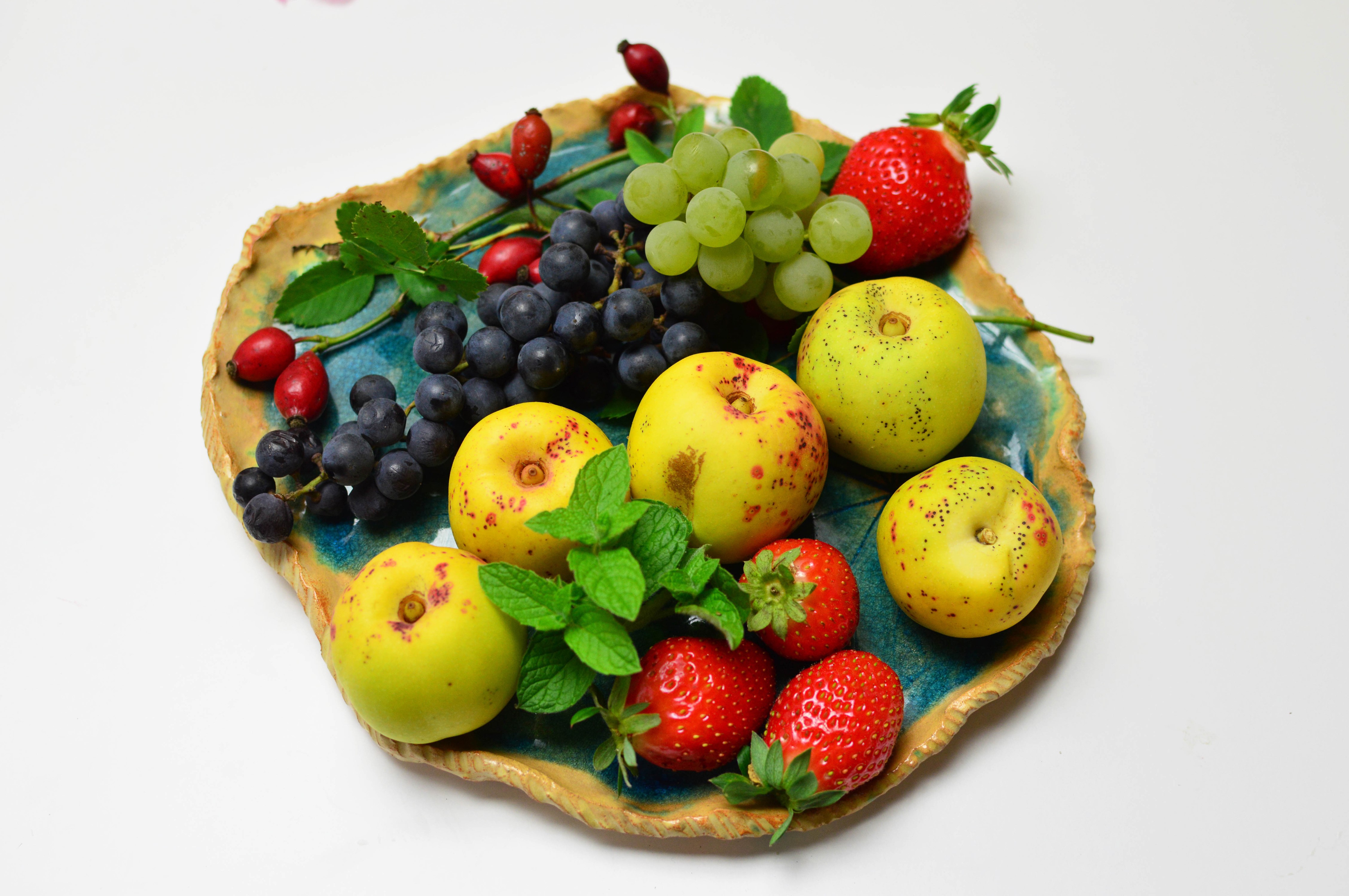 Apples, Grapes, Strawberries, and Rose Hips on a Plate HD Wallpaper