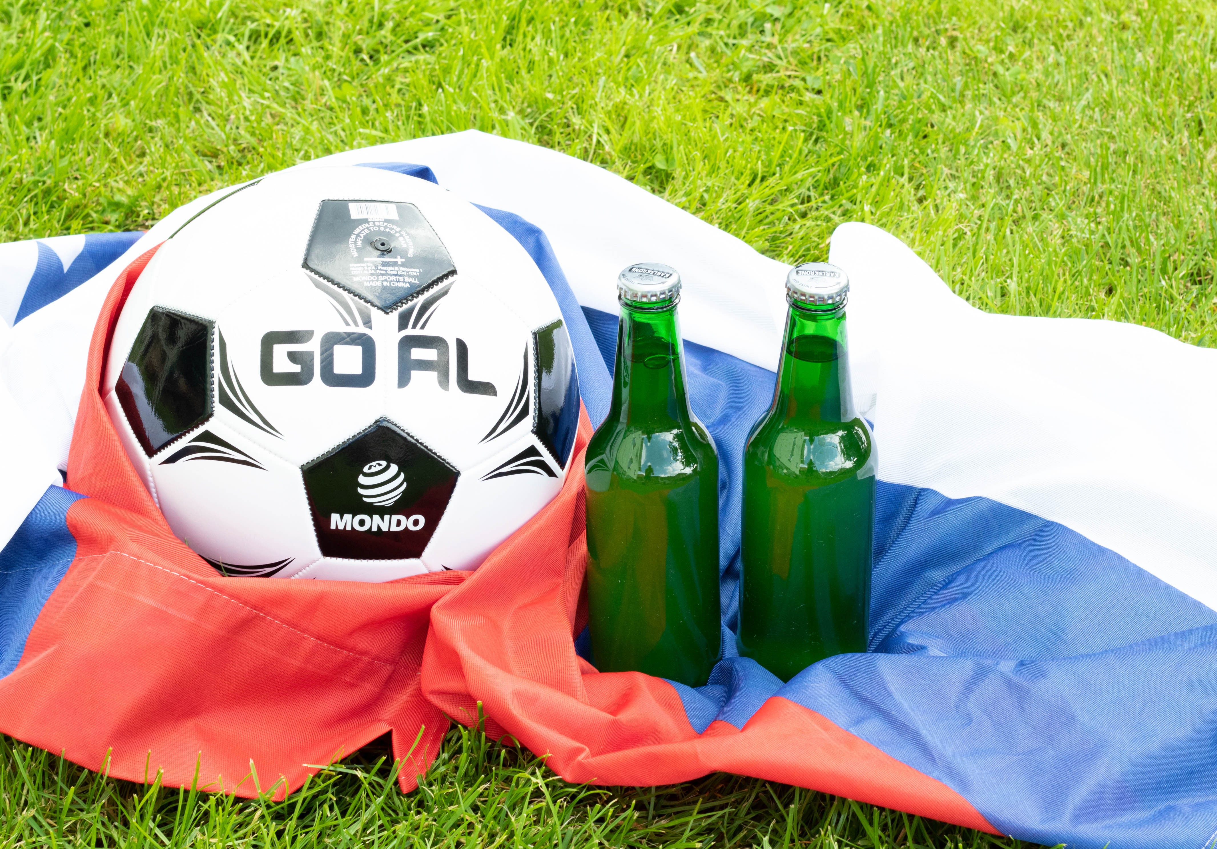 Soccer ball and beer bottles on flag HD Wallpaper