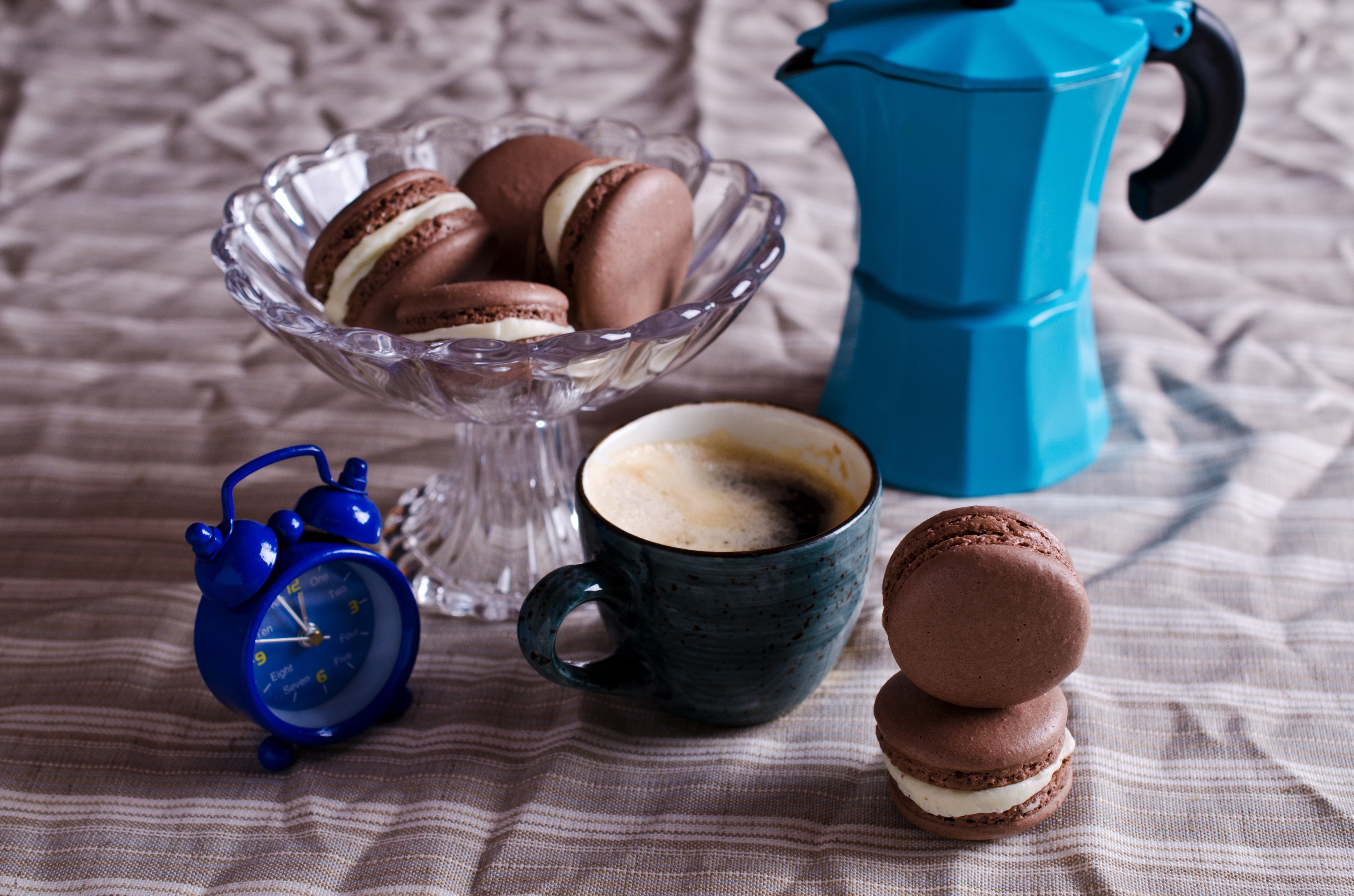 Chocolate macarons with coffee and alarm clock HD Wallpaper