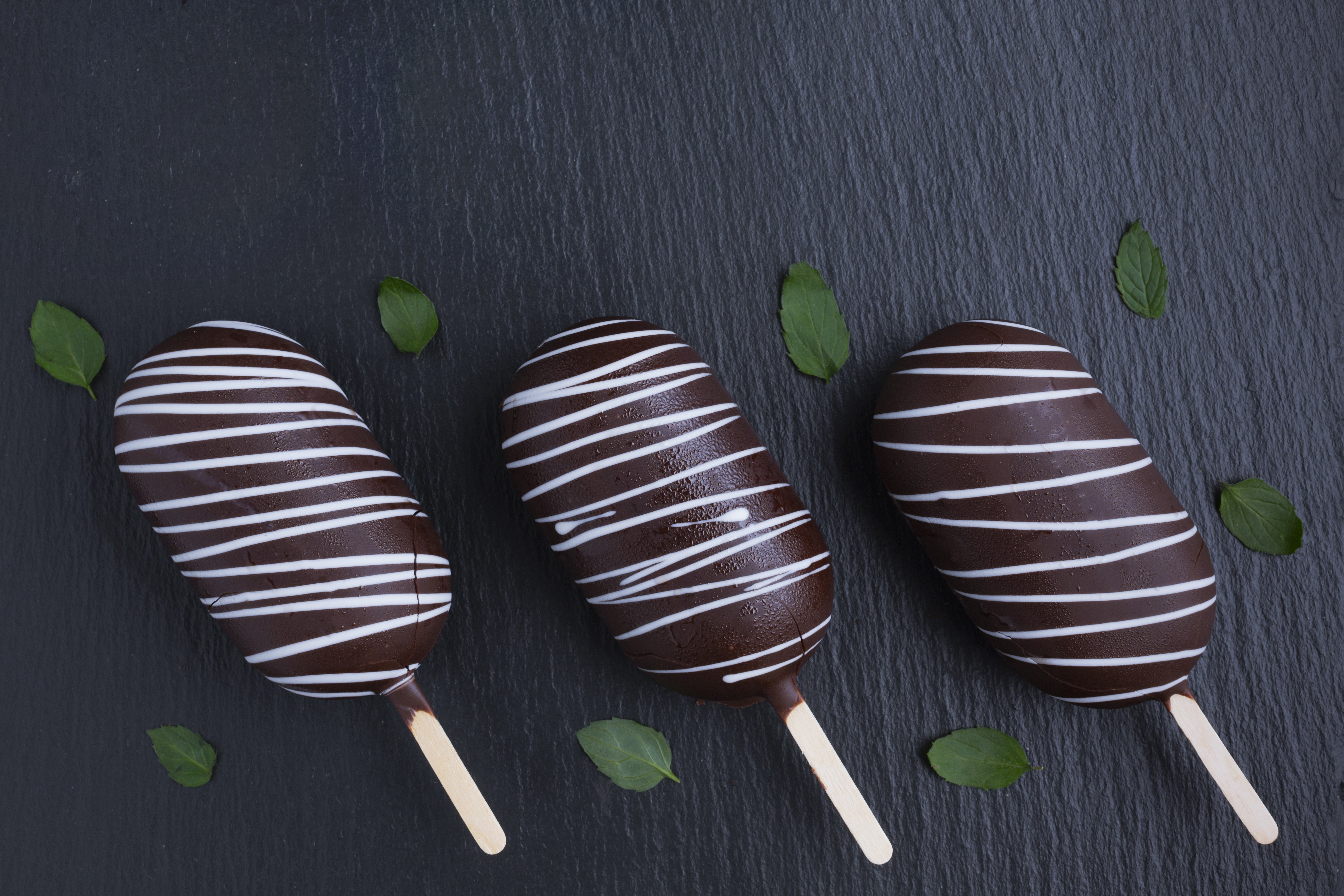 Three chocolate ice cream bars with white stripes HD Wallpaper