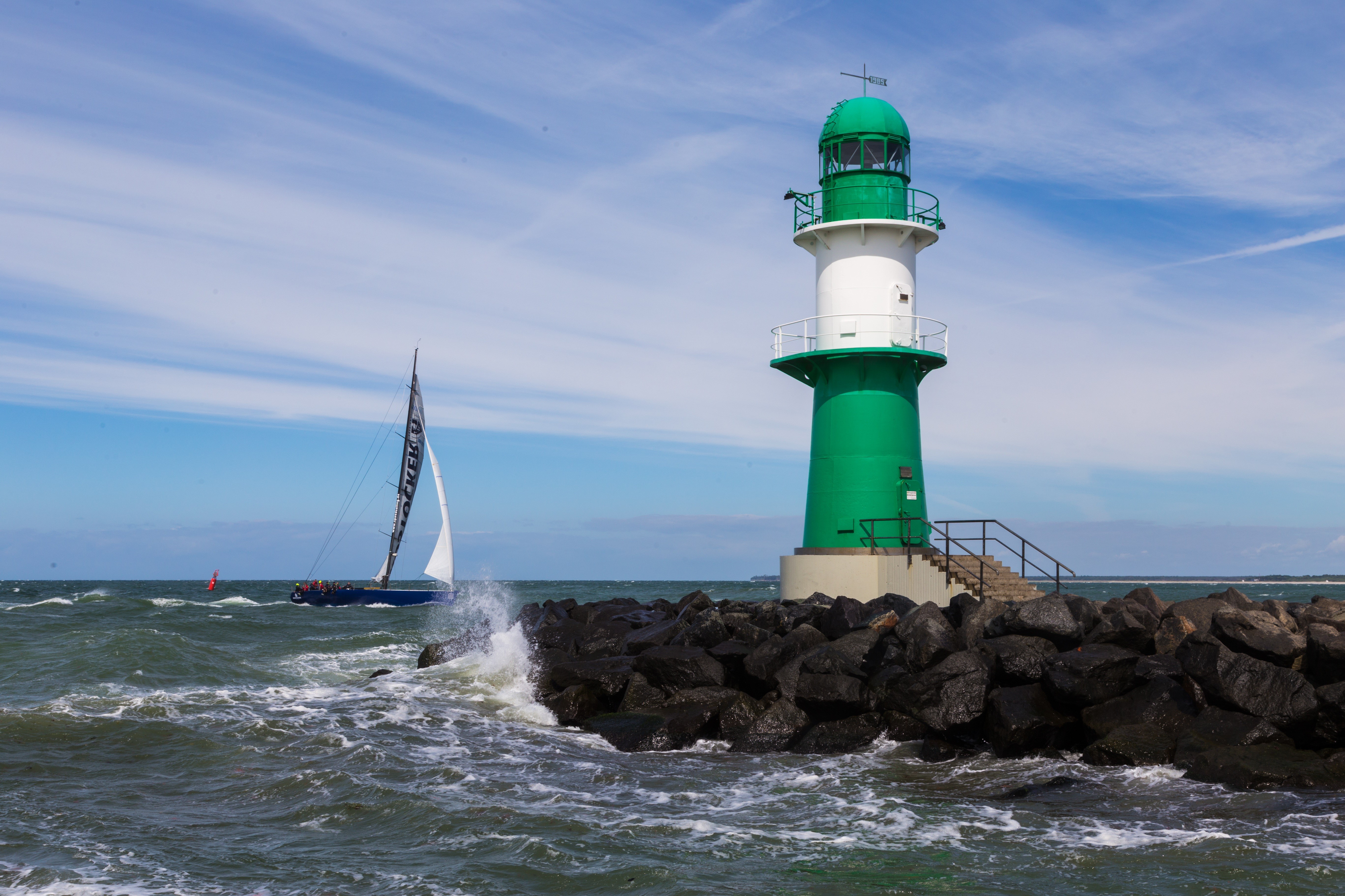 Sailboat and Lighthouse in Warnemunde, Baltic Sea, Germany HD Wallpaper