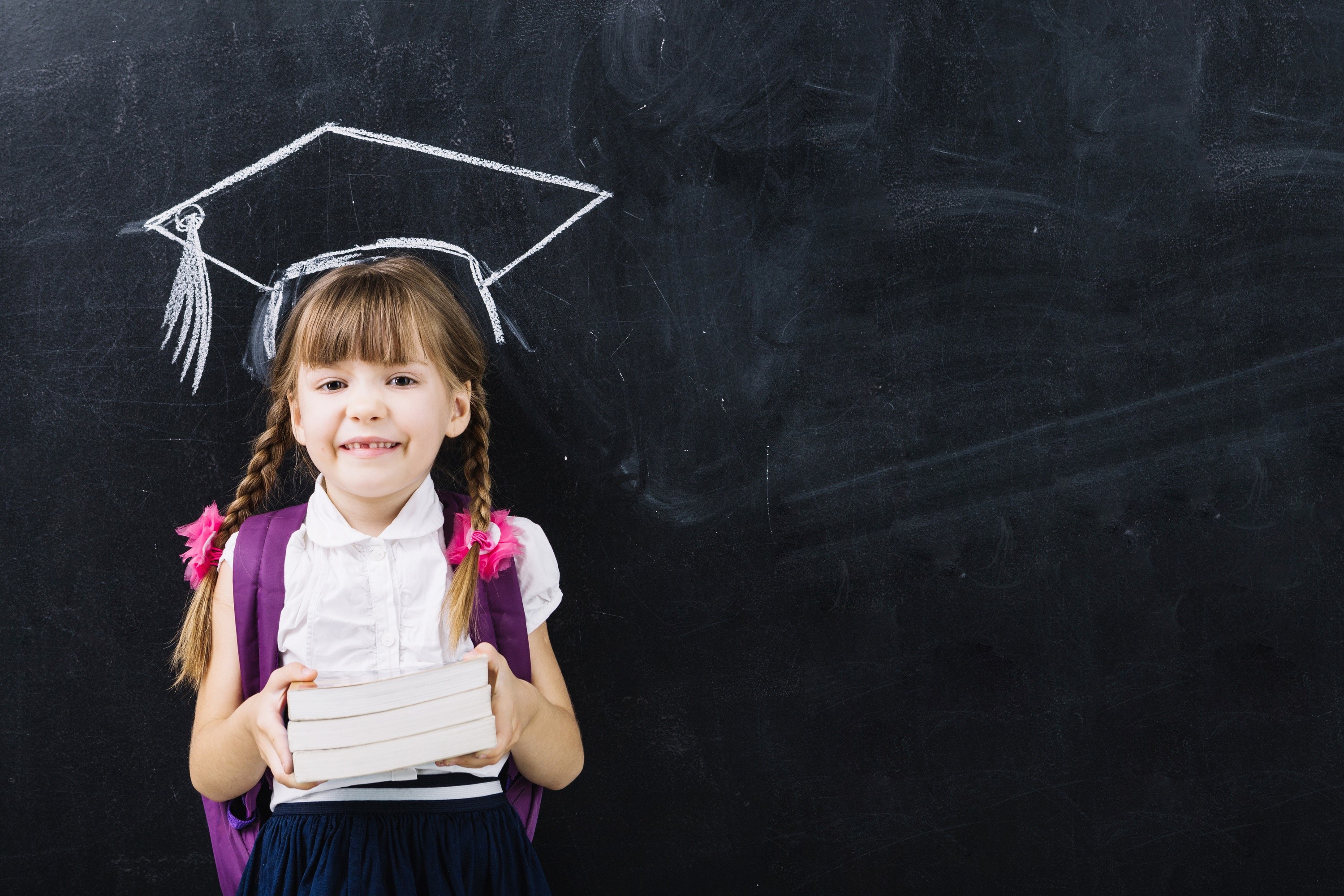 Girl with graduation cap drawing and books HD Wallpaper