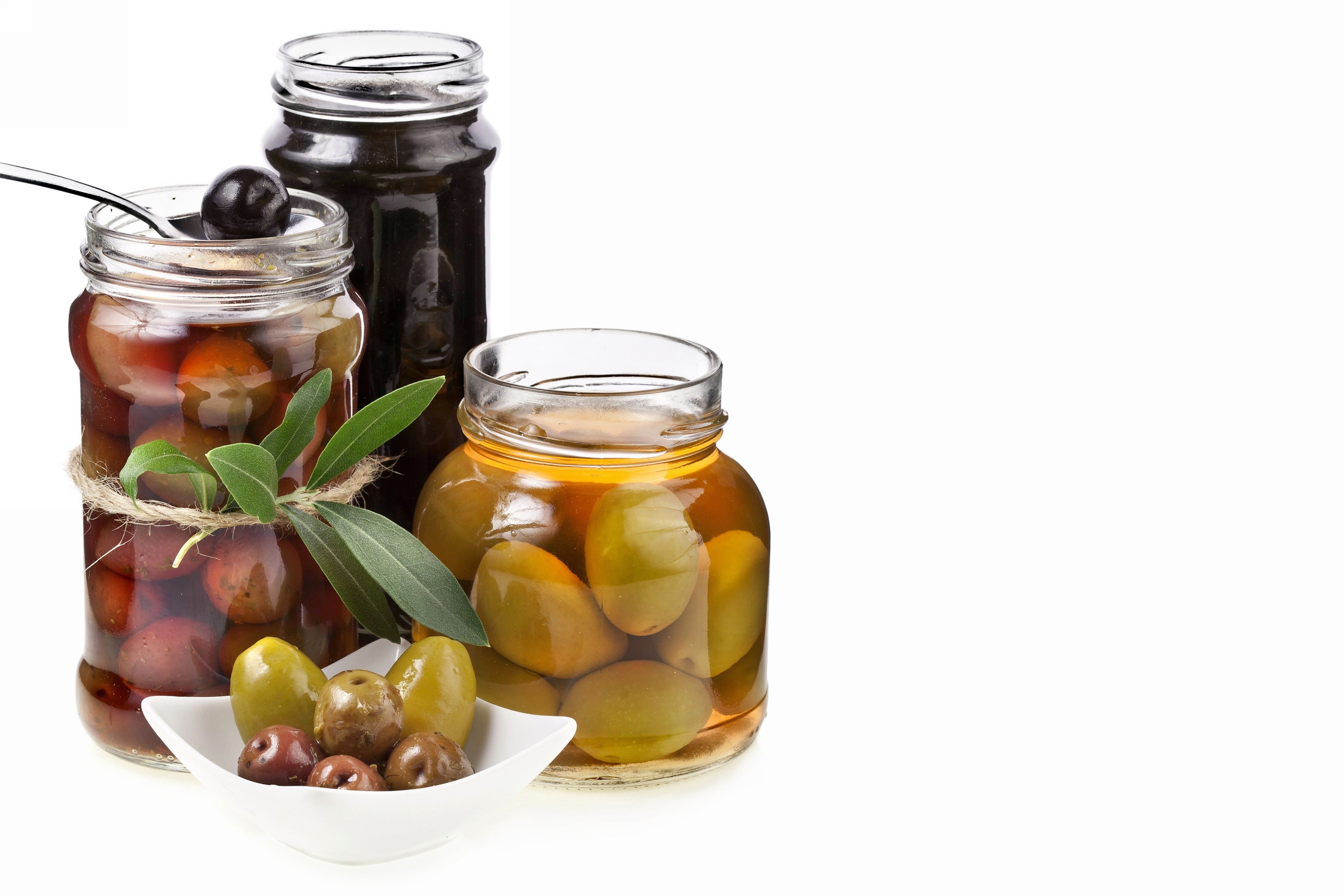 Olives in jars with a white background HD Wallpaper