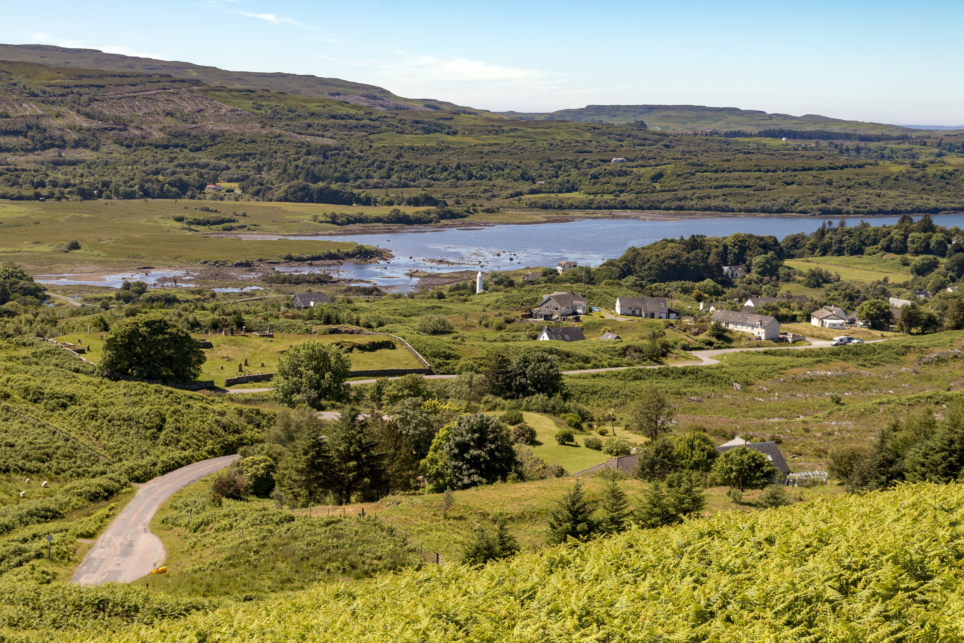 Village of Dervaig with a bay and surrounding hills HD Wallpaper