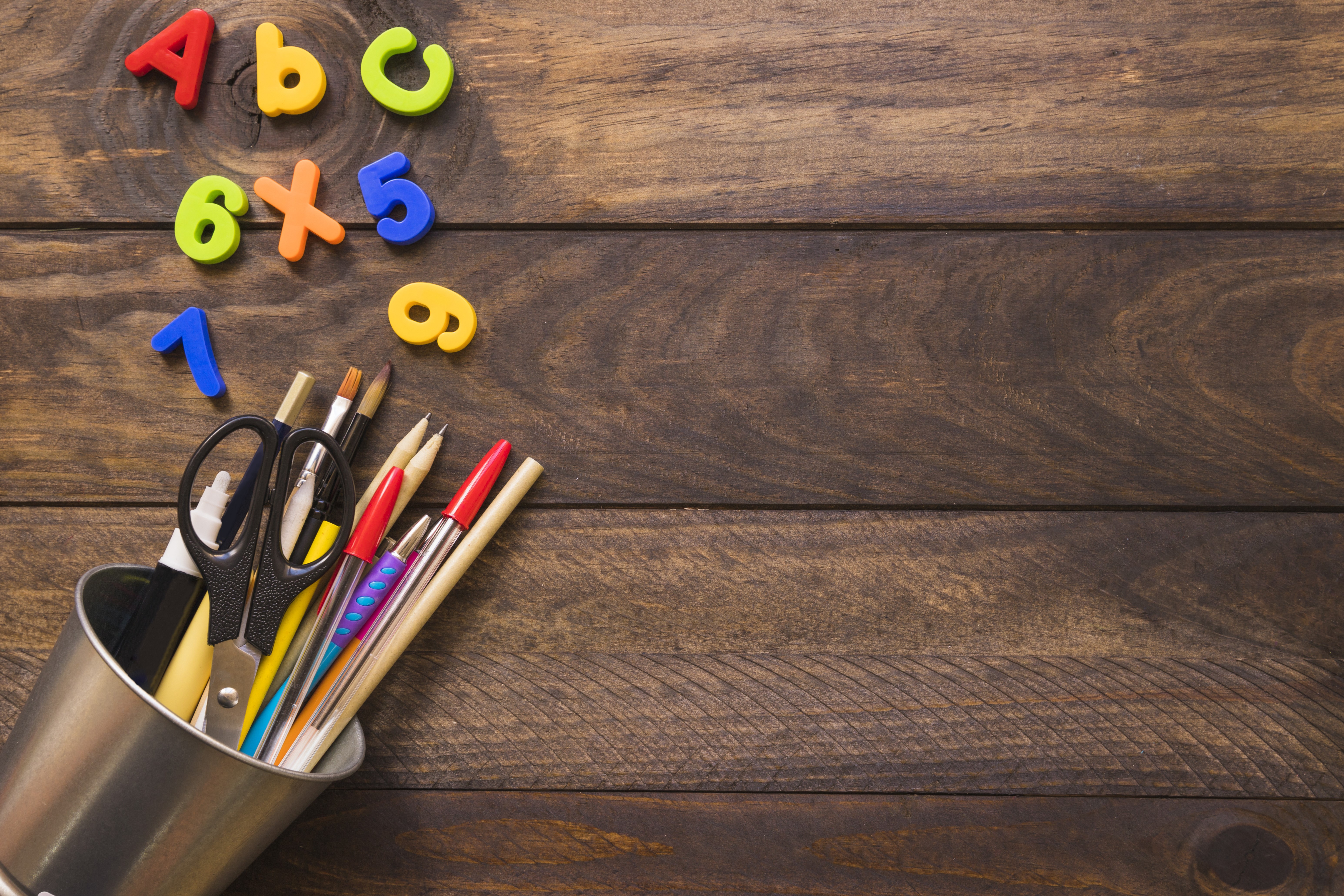 School supplies and letters on wood planks HD Wallpaper