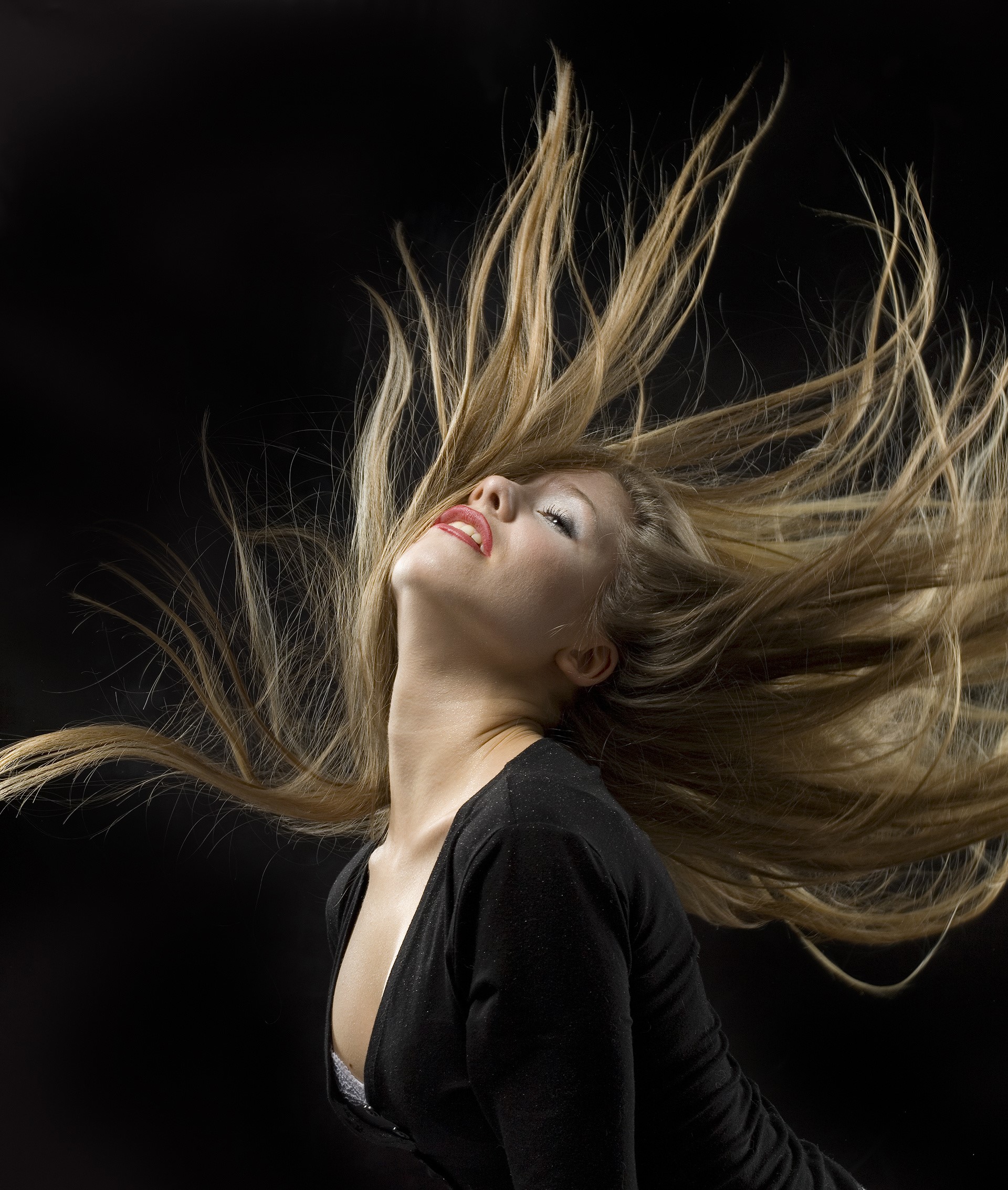 Woman with blonde hair flipping her head HD Wallpaper