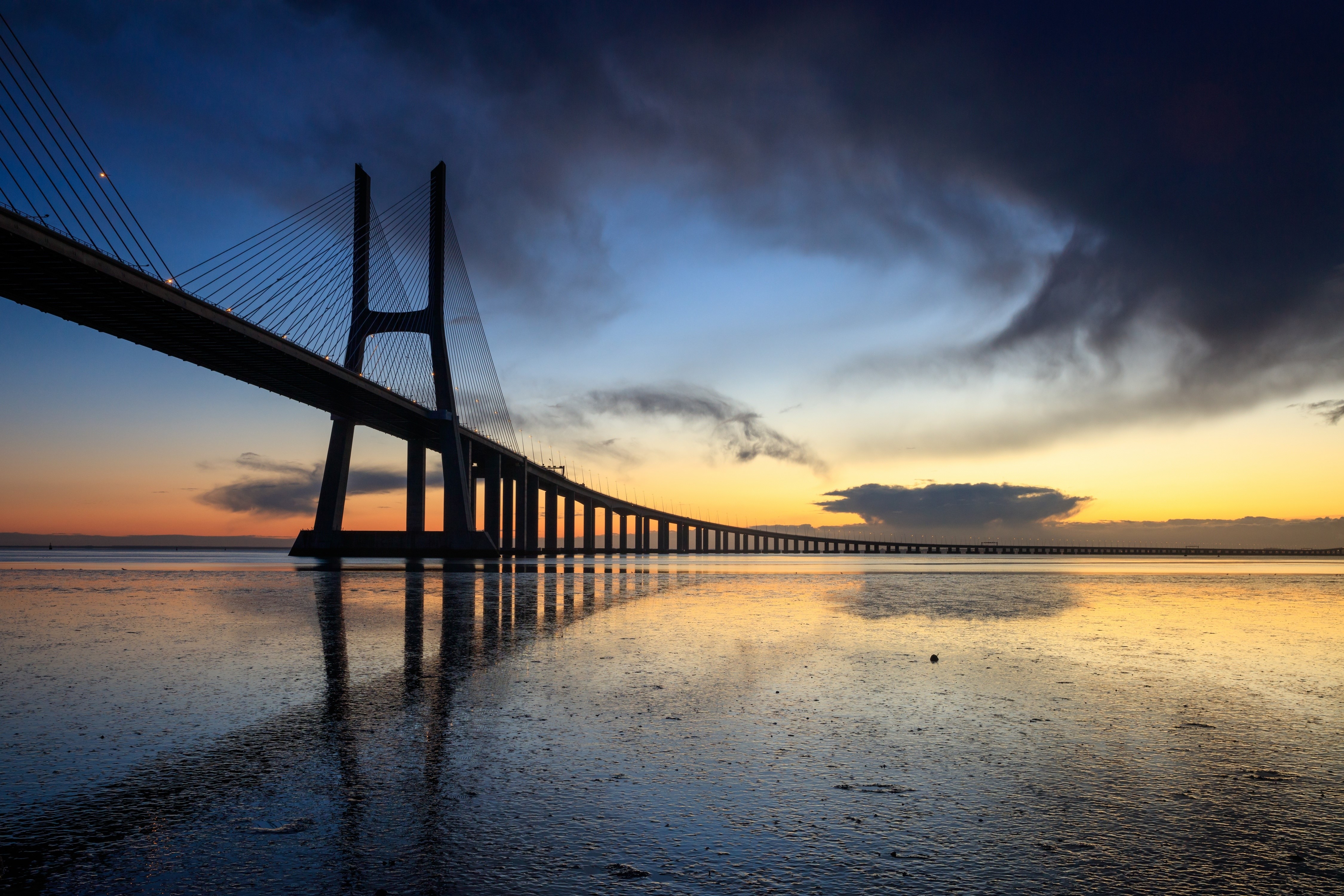 Vasco da Gama Bridge at sunset in Lisbon, Portugal HD Wallpaper