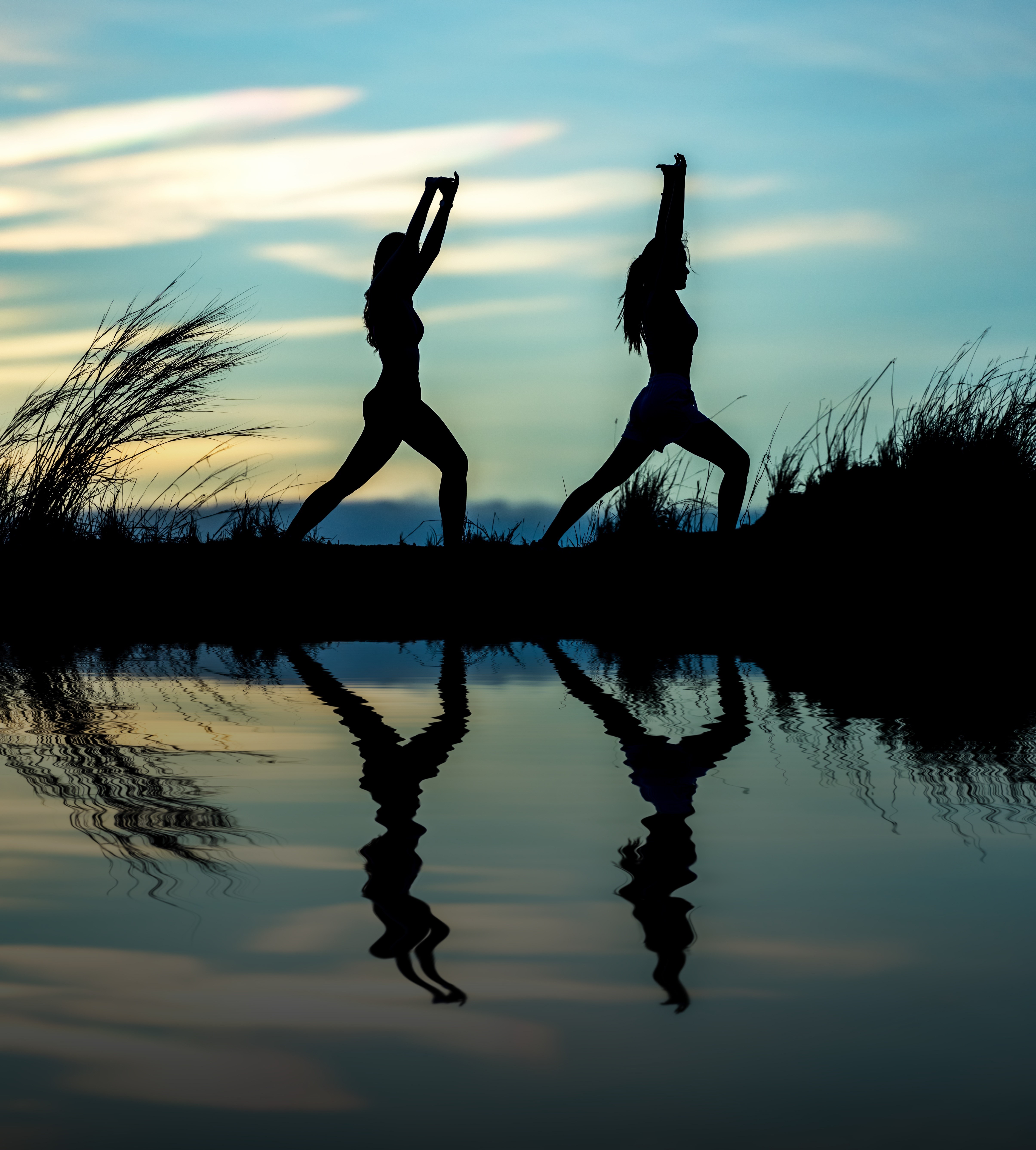 Two Silhouettes Doing Yoga by Water at Sunset HD Wallpaper