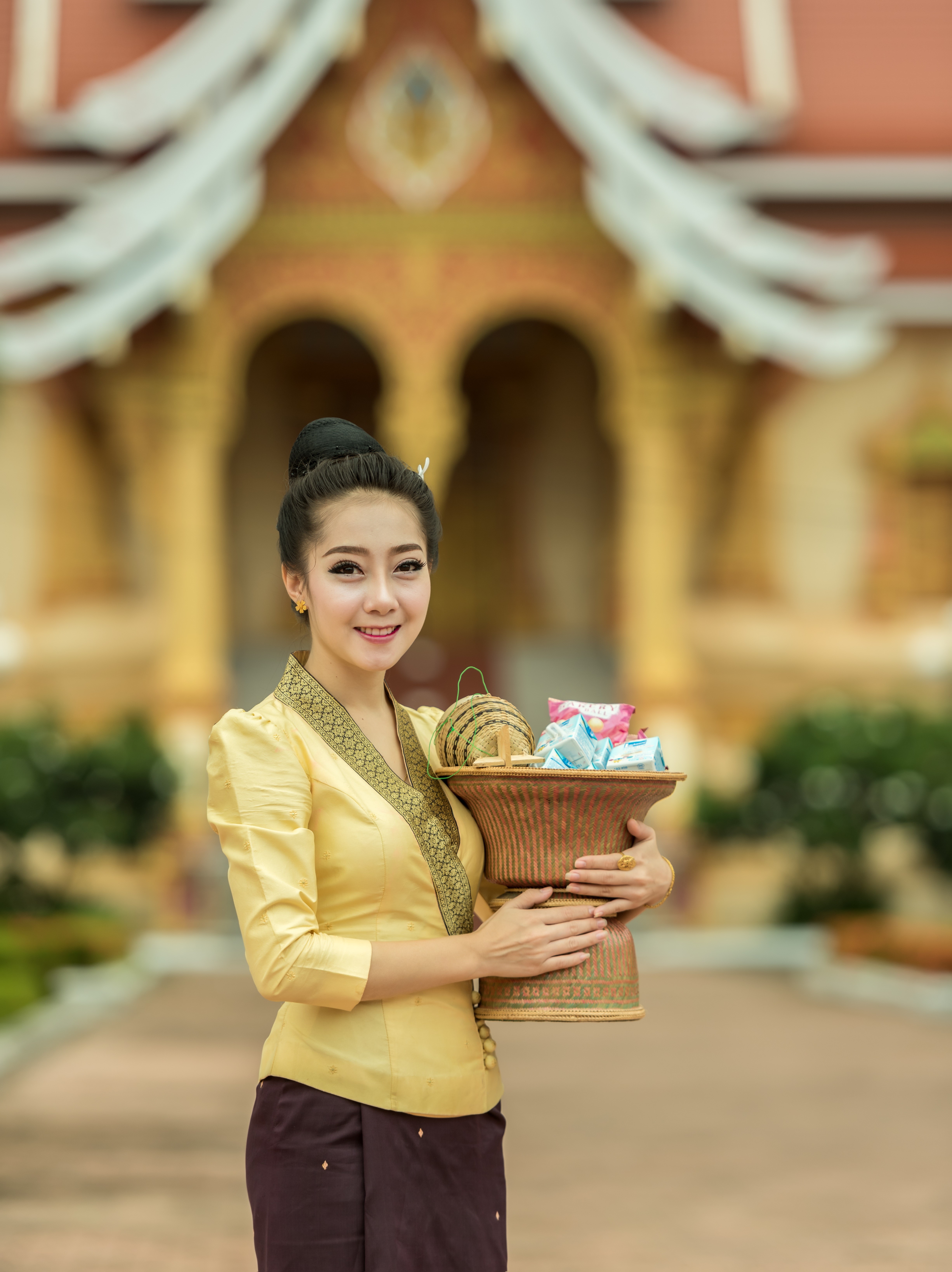 Asian woman in traditional clothing holding a basket HD Phone Wallpaper