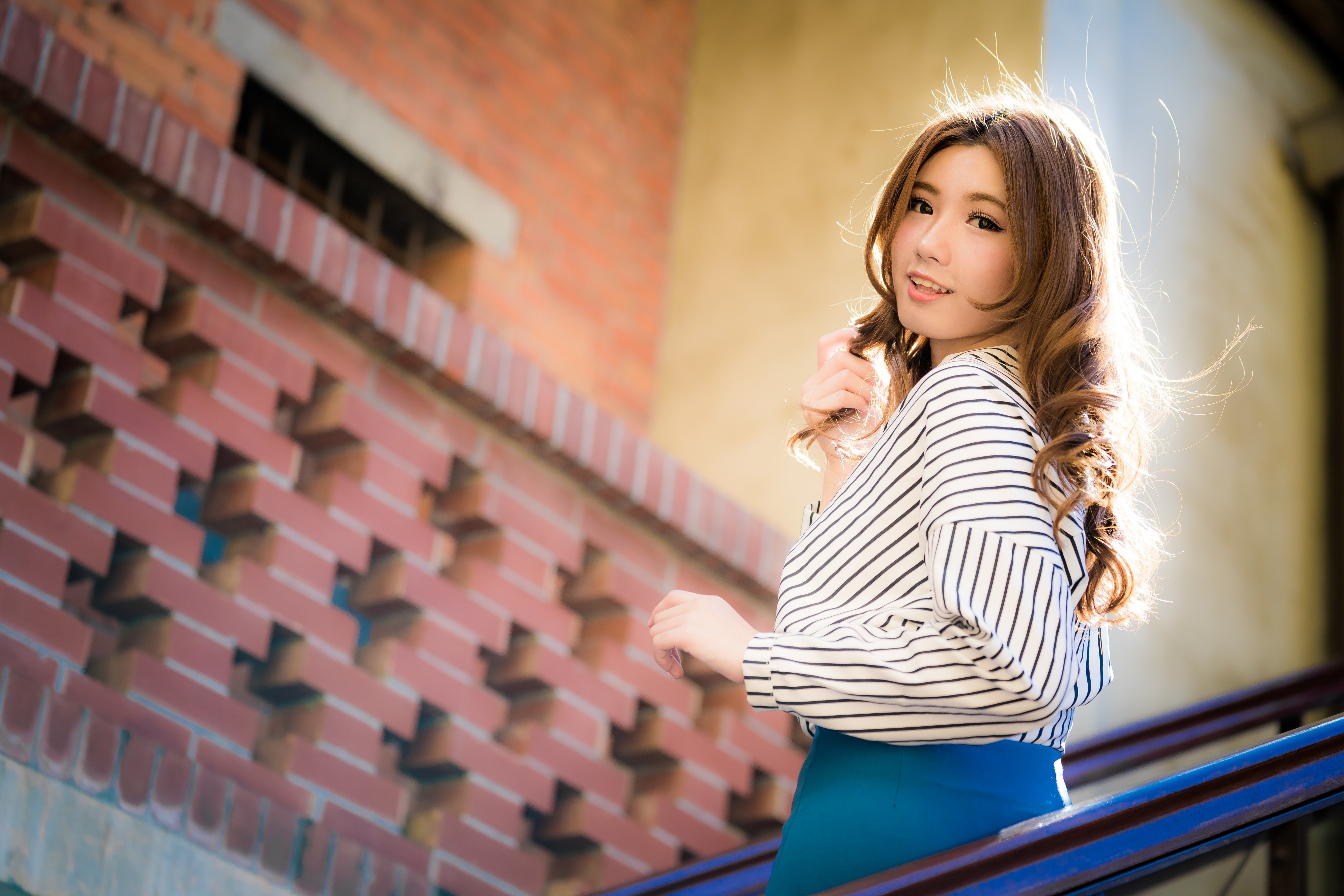 Asian woman with brown hair in striped shirt HD Wallpaper