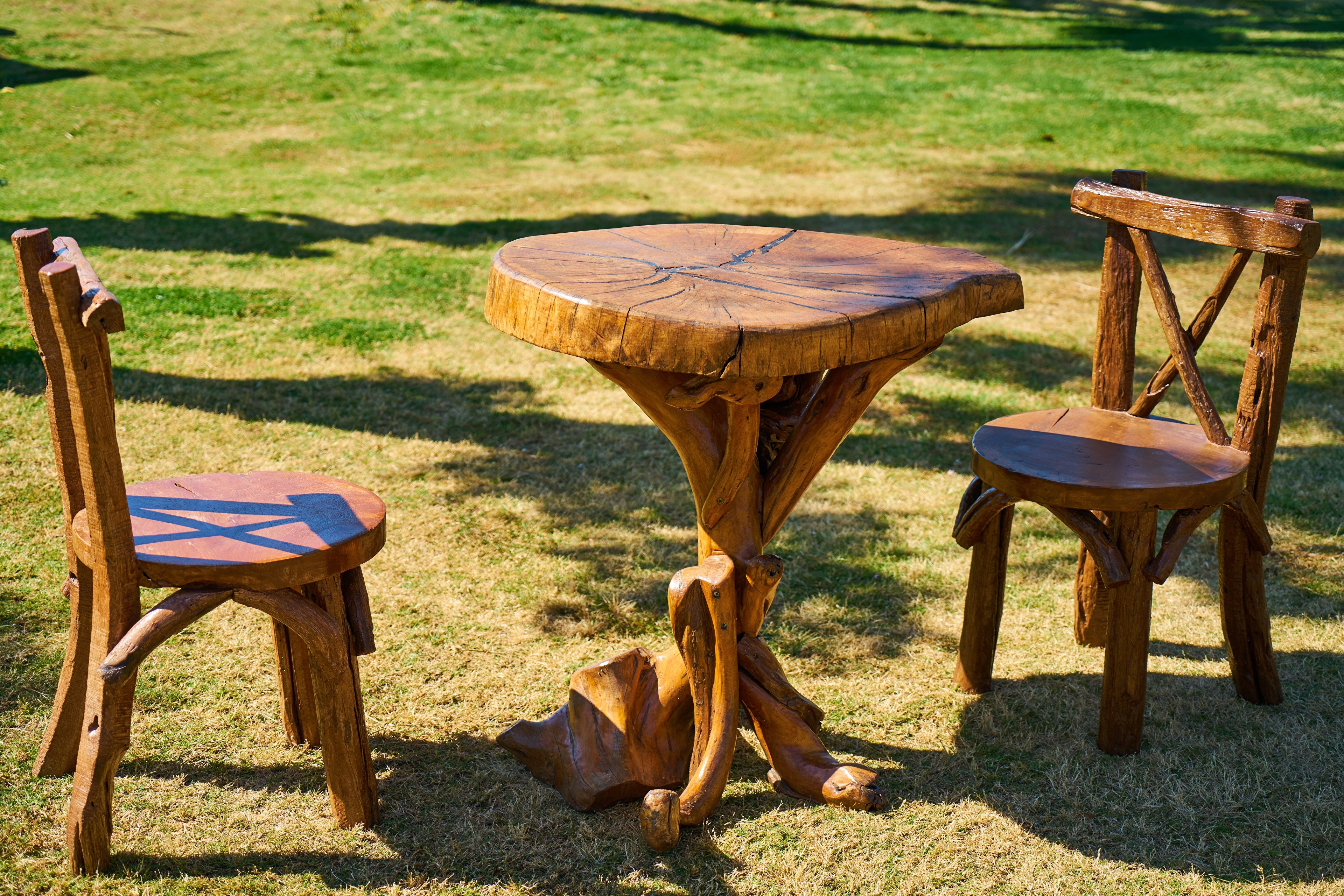 Wooden table and chairs on grass HD Wallpaper