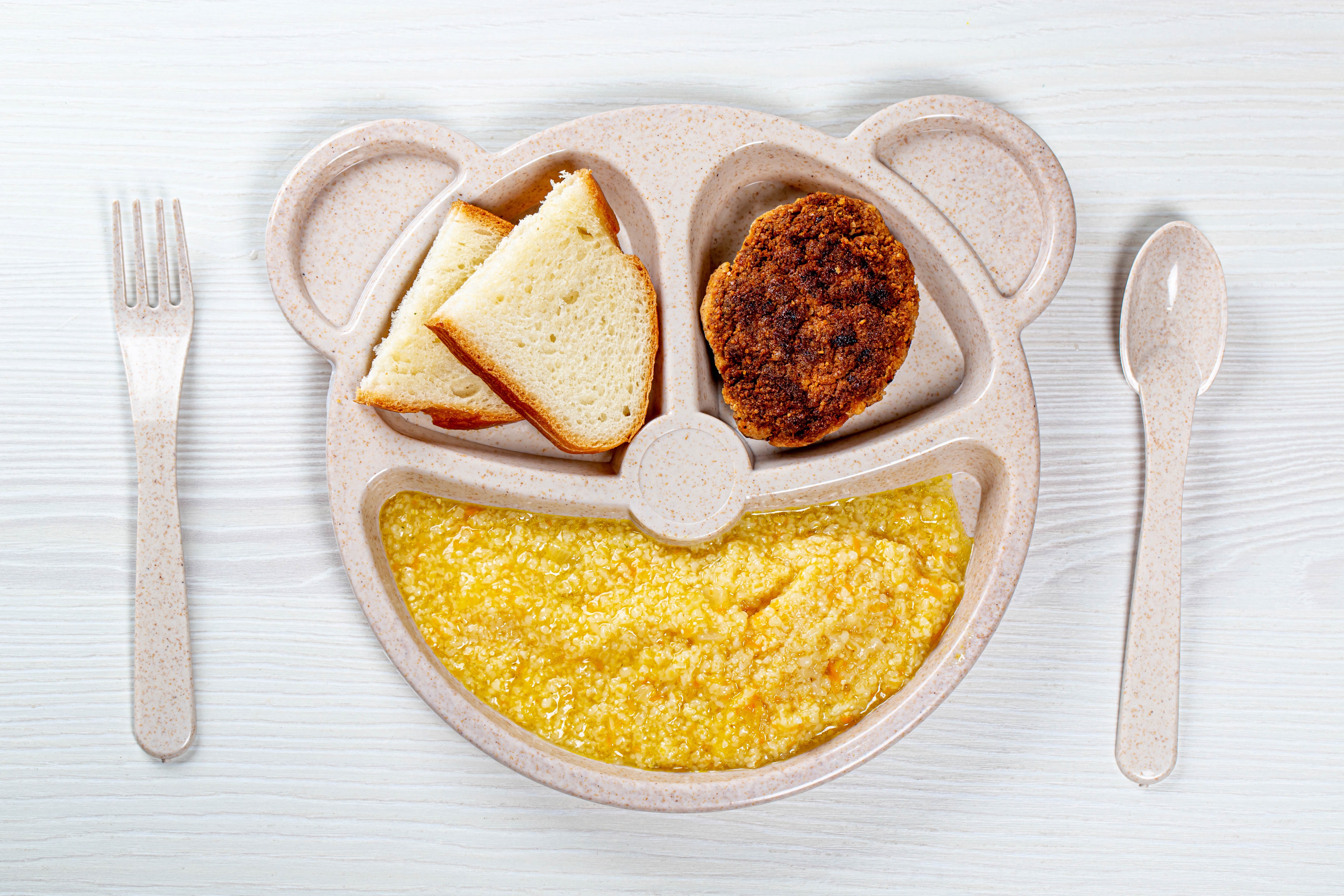 Bear-shaped plate with breakfast: bread, patty, and porridge HD Wallpaper