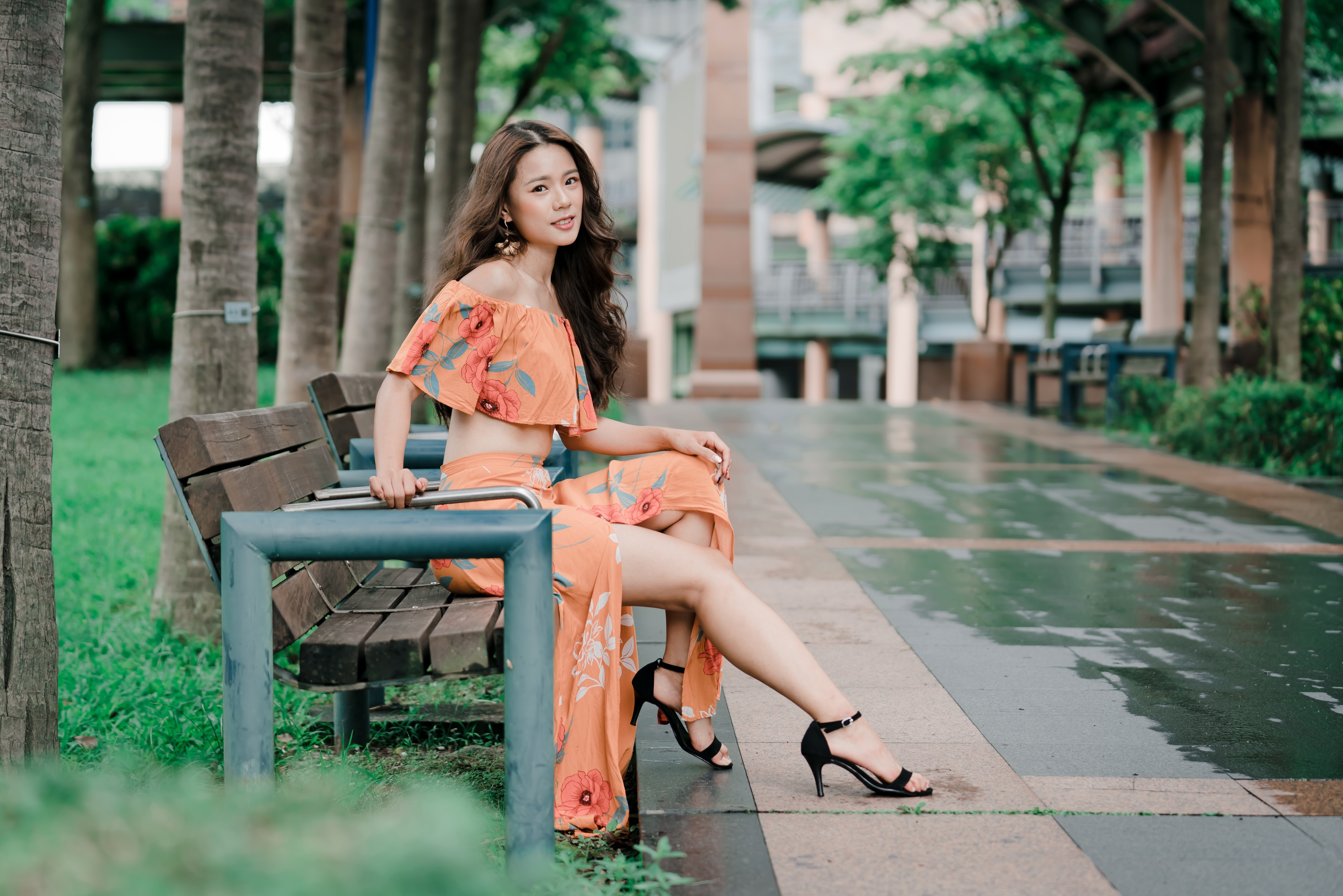 4K Portrait of Woman Sitting on Bench Outdoors HD Wallpaper