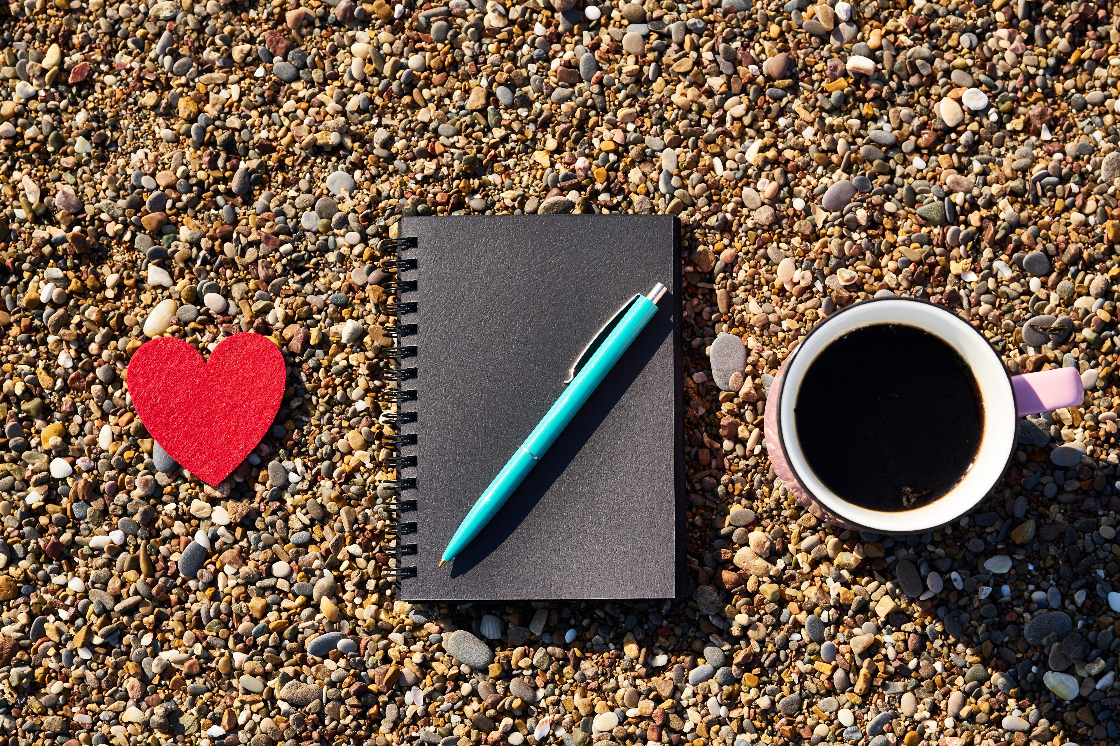 Heart, Notepad, Pen, and Coffee on Pebbles HD Wallpaper