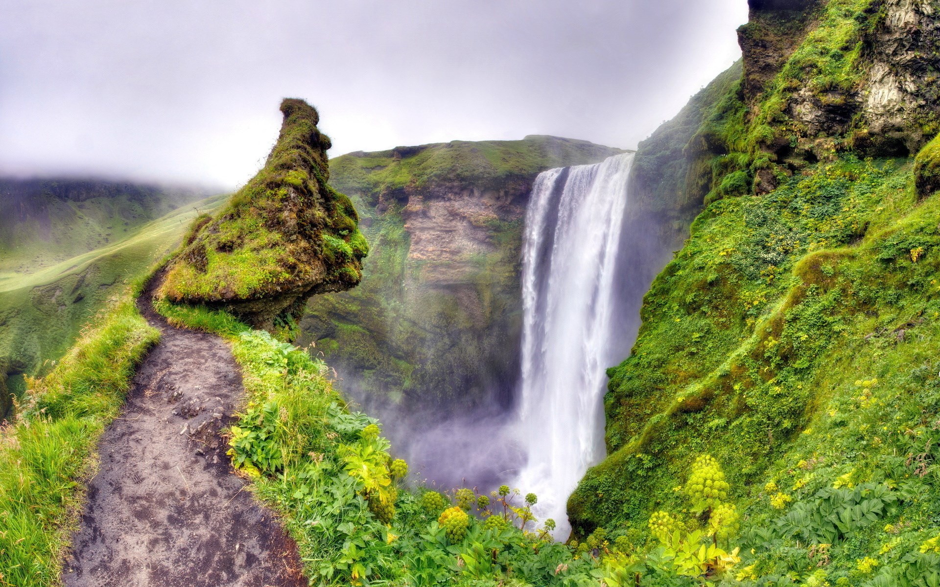 Mossy rock formation and waterfall in Iceland HD Wallpaper