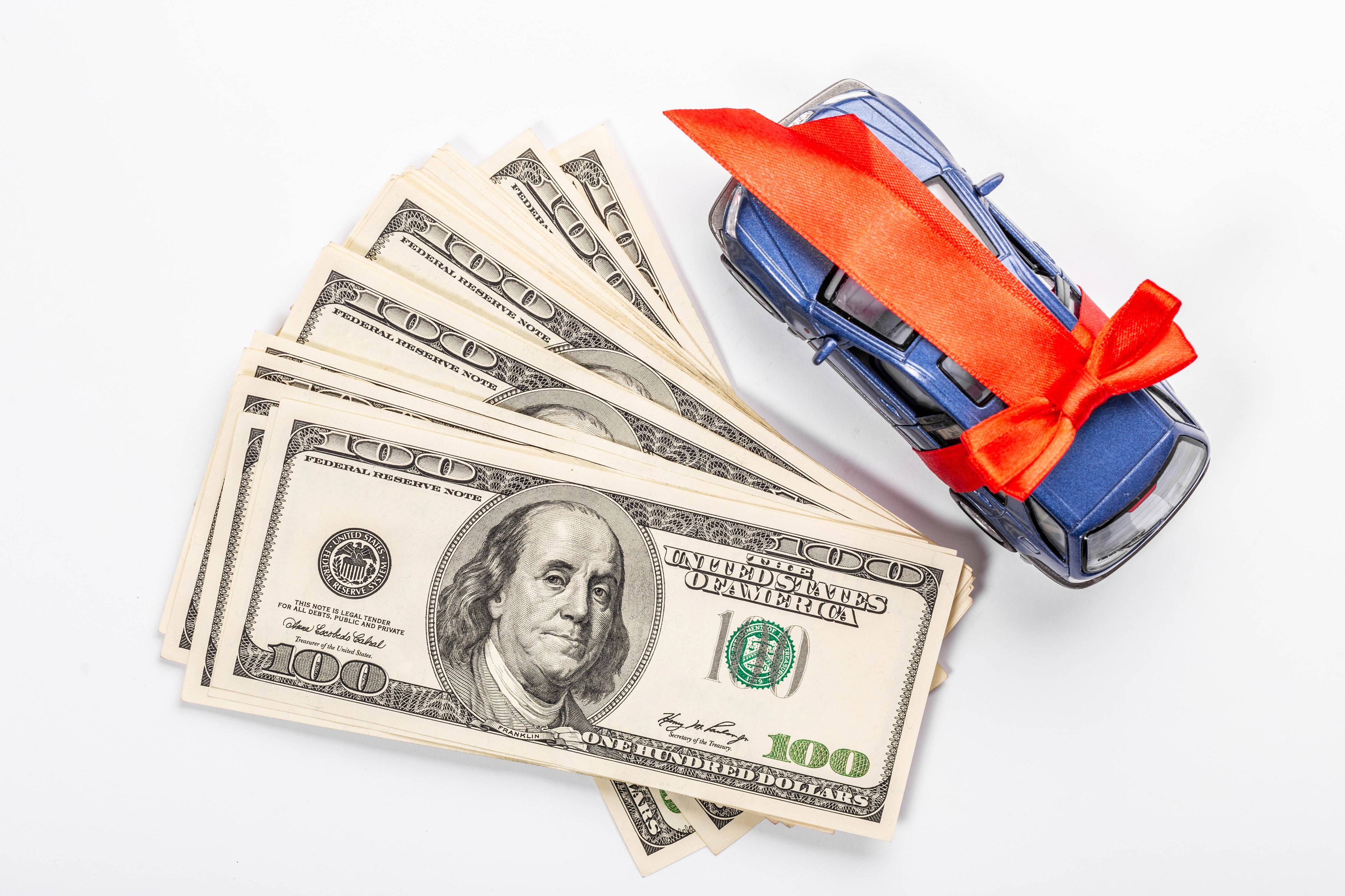 US Dollar Bills and Toy Car with Red Ribbon HD Wallpaper
