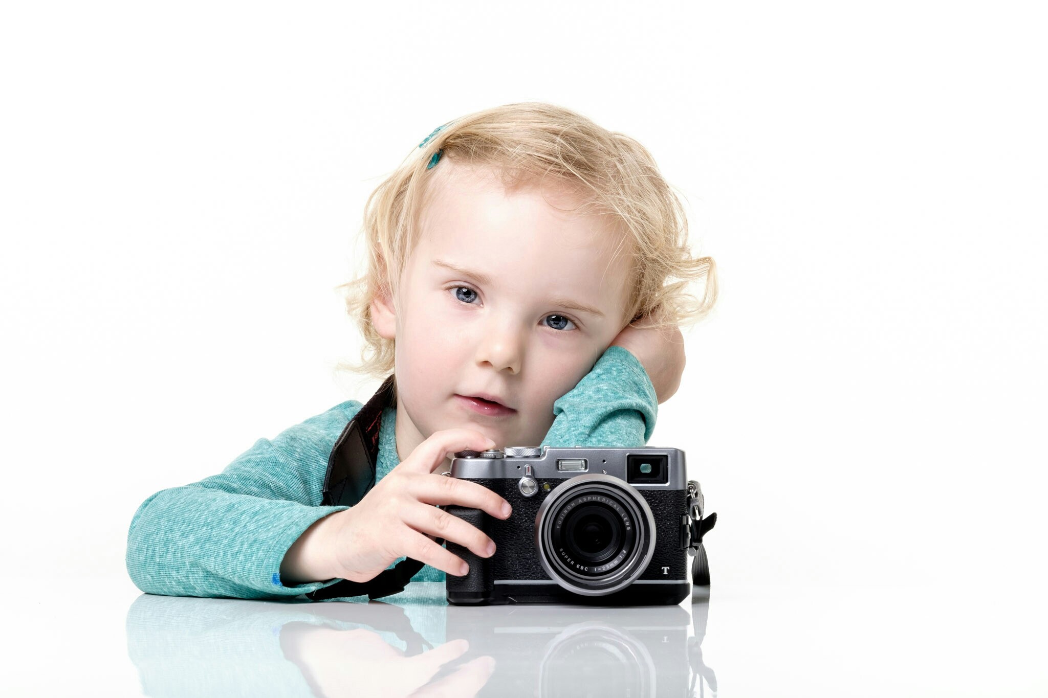 Young girl with a camera on a white background HD Wallpaper
