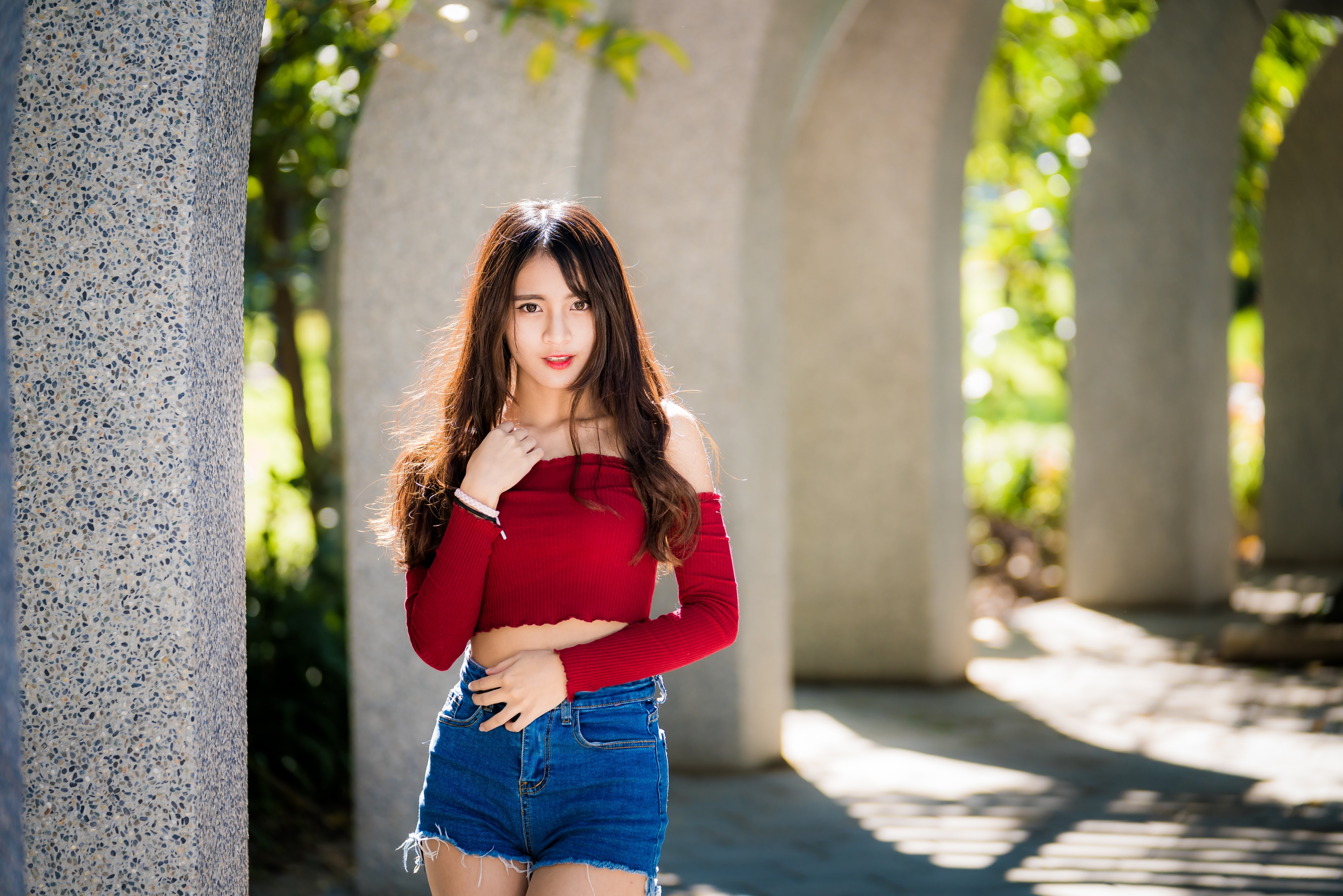 4K Portrait of Woman in Red Top and Denim Shorts HD Wallpaper