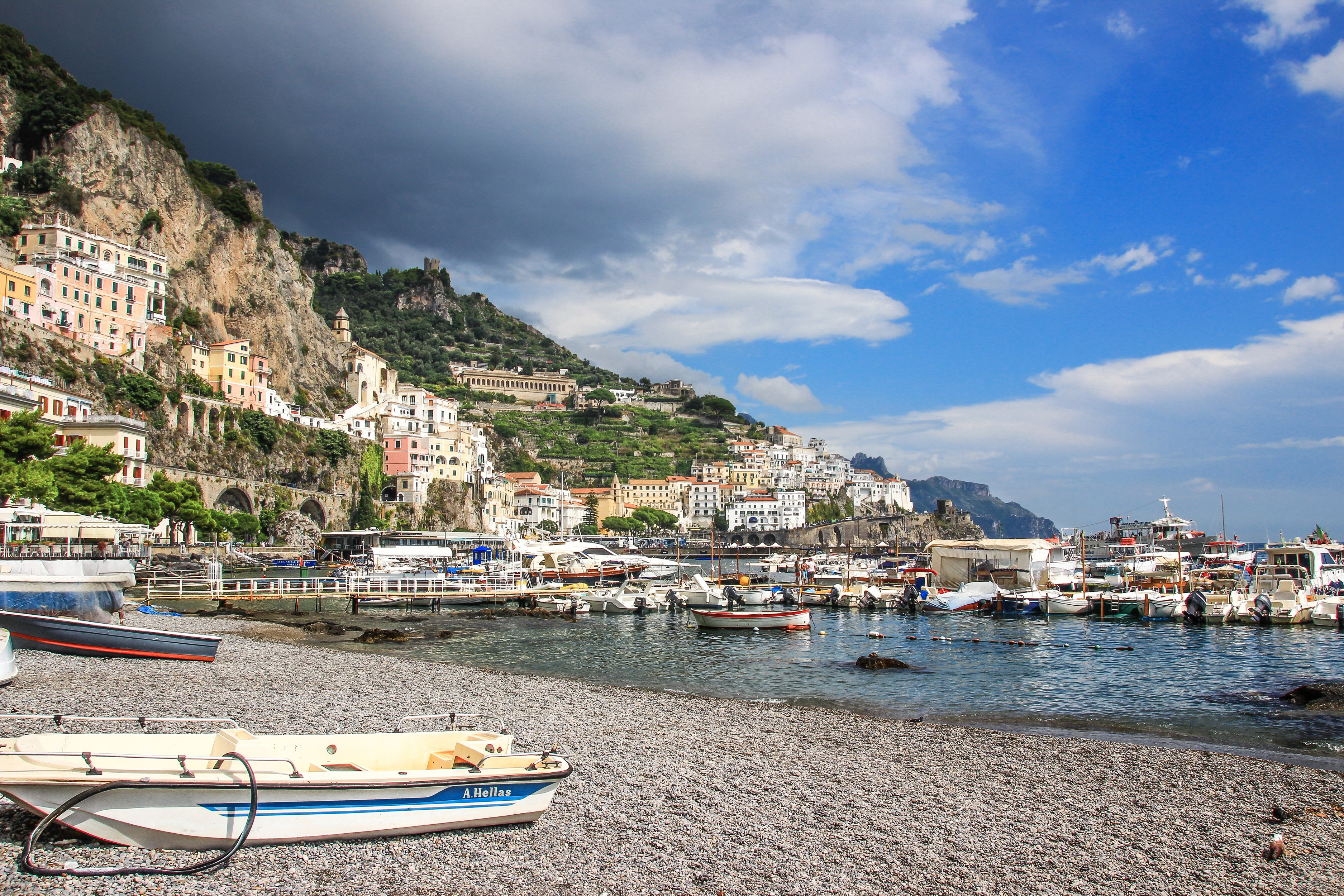Amalfi Coast town with boats in the harbor HD Wallpaper