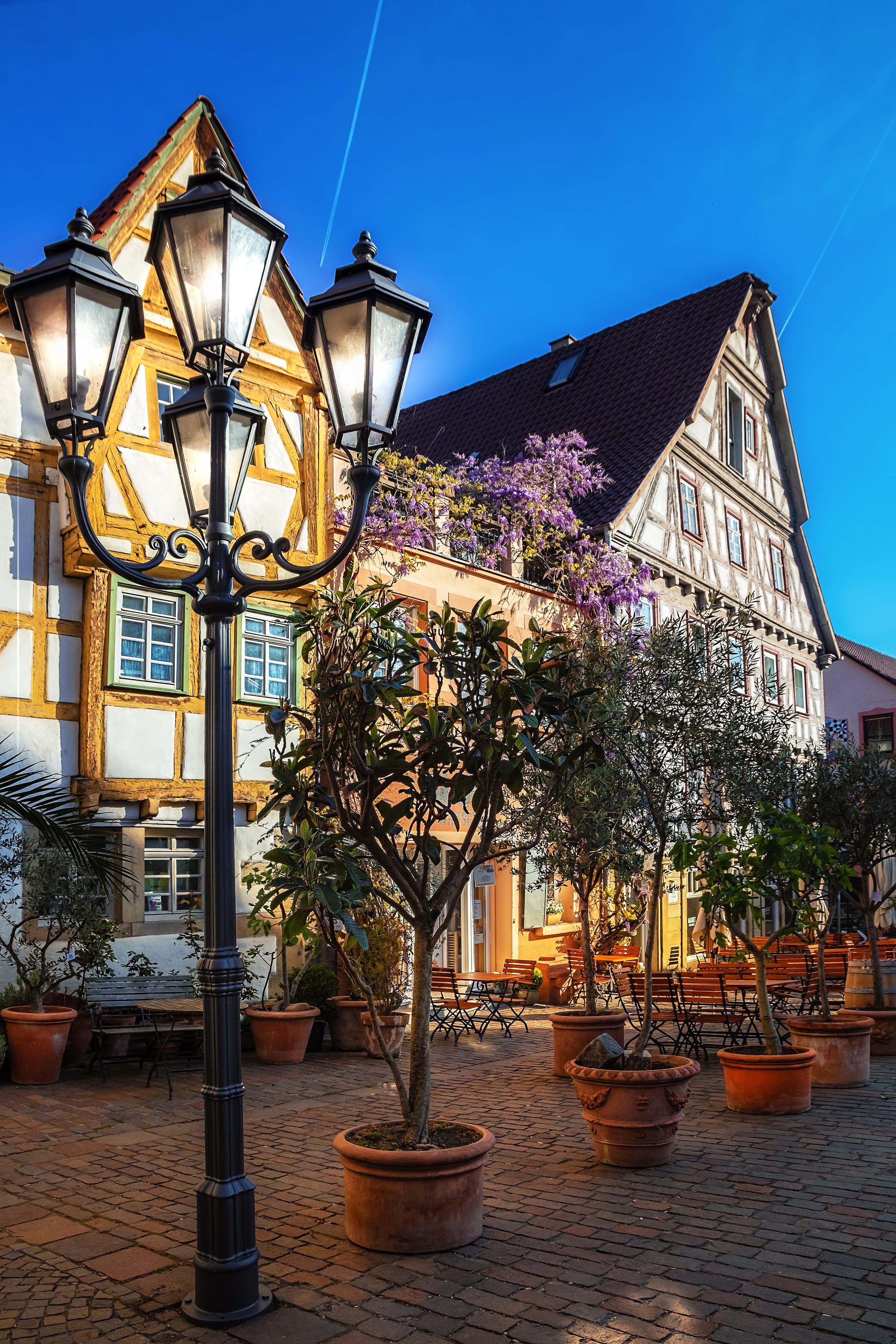Half-timbered houses and street lamp in Besigheim, Germany HD Phone Wallpaper