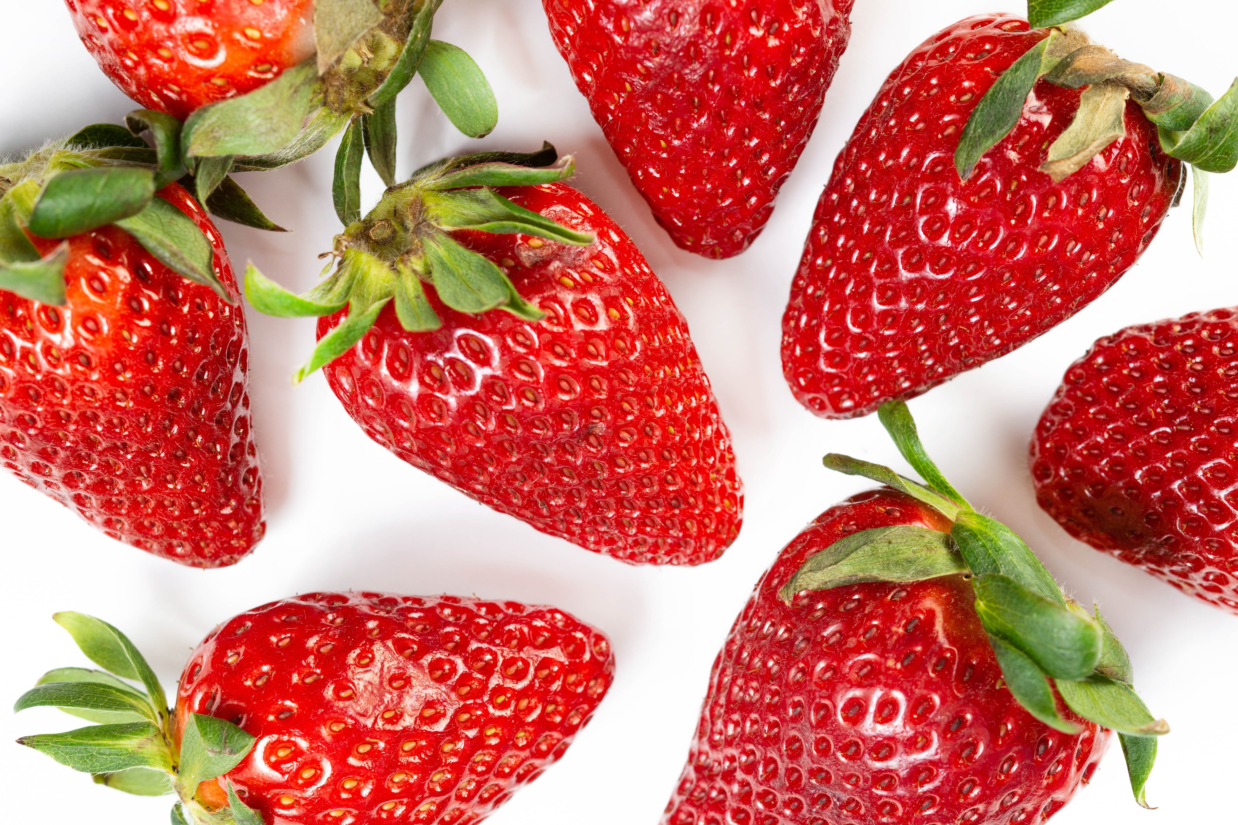 4K Strawberry Closeup on White Background HD Wallpaper