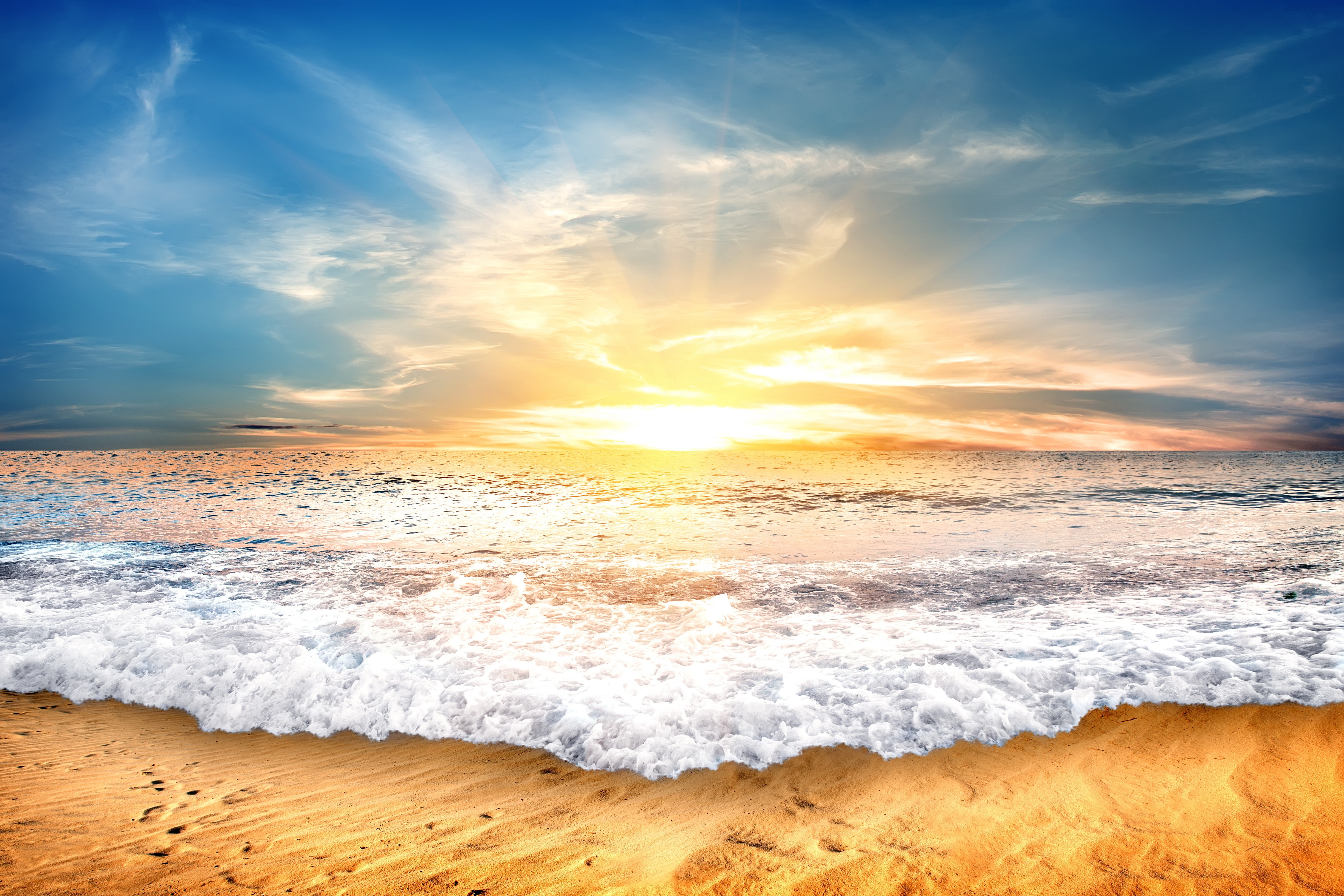 Sunset over the ocean with waves on the beach HD Wallpaper
