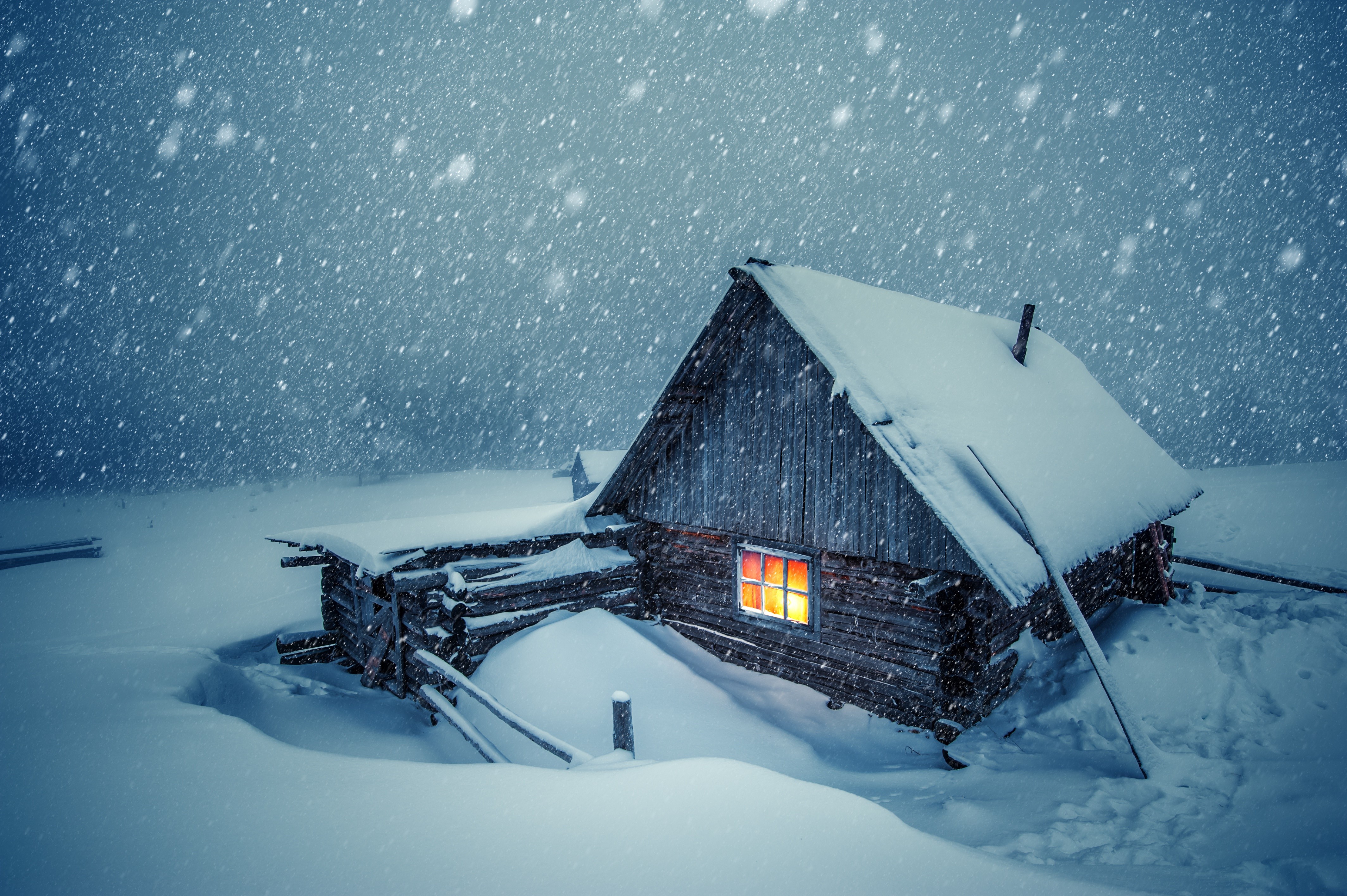 Wooden house in a snowstorm HD Wallpaper