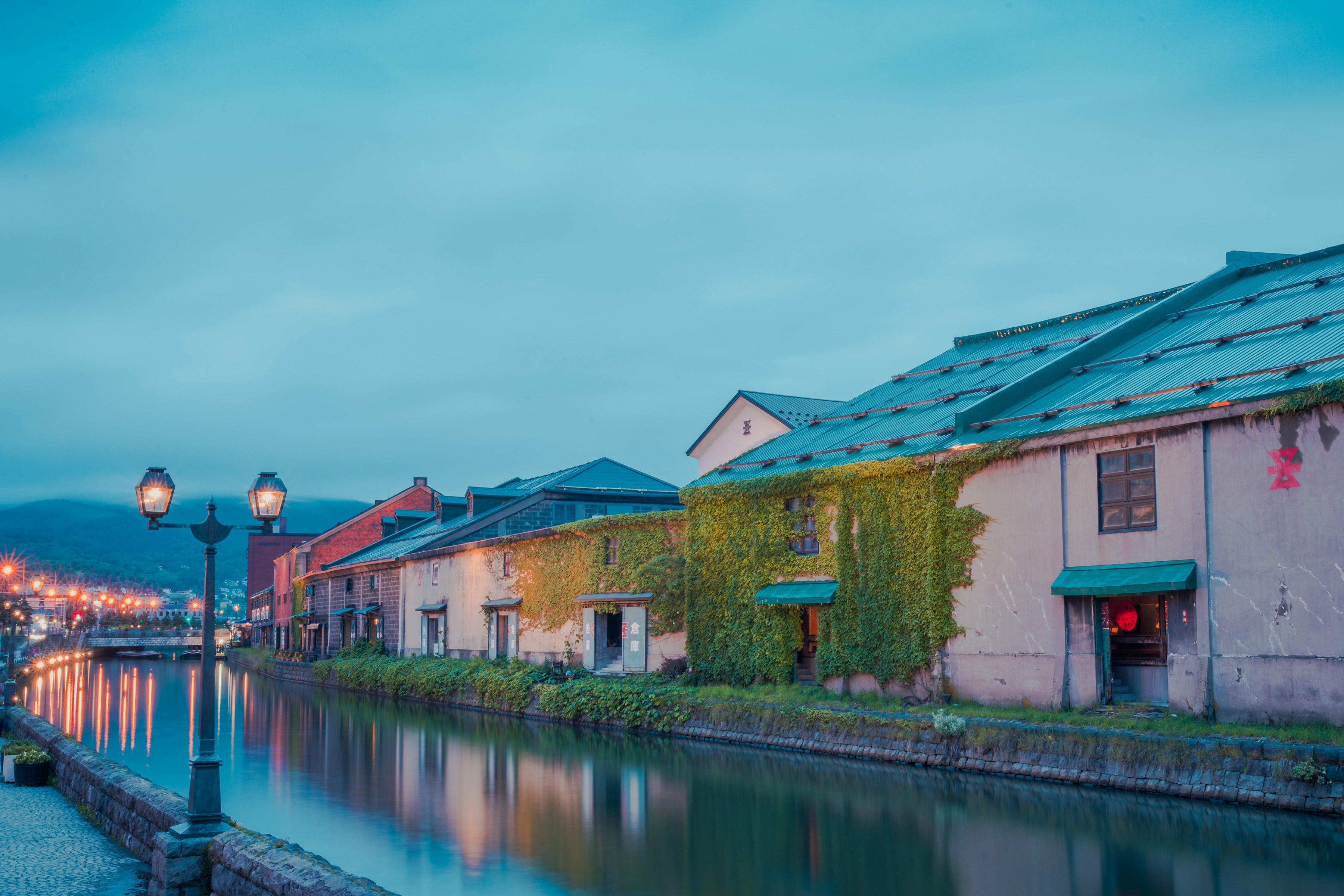 Canal and historic buildings in Otaru, Hokkaido, Japan at dusk HD Wallpaper
