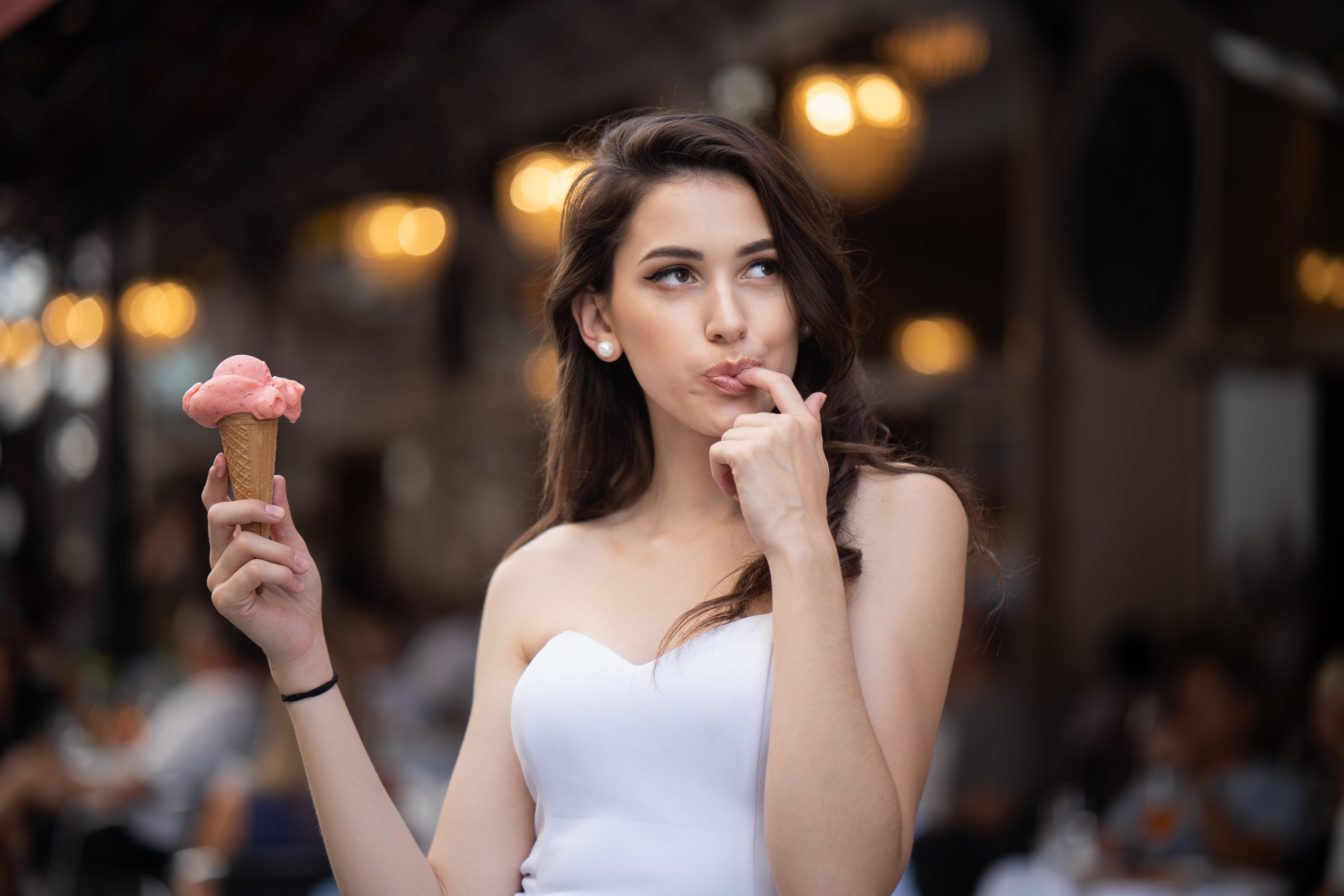 Woman holding ice cream with bokeh background HD Wallpaper