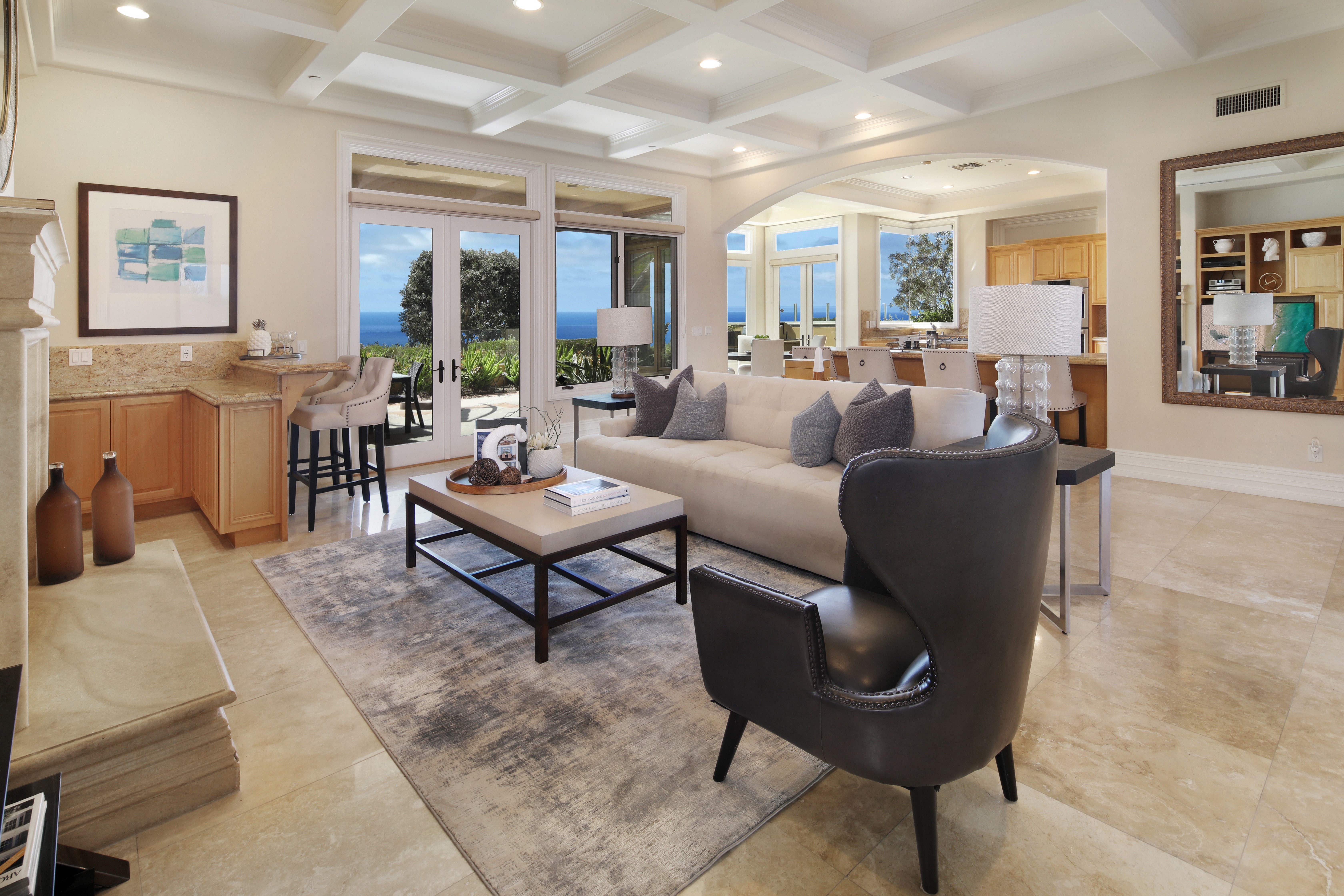 Living room with ocean view and bar HD Wallpaper