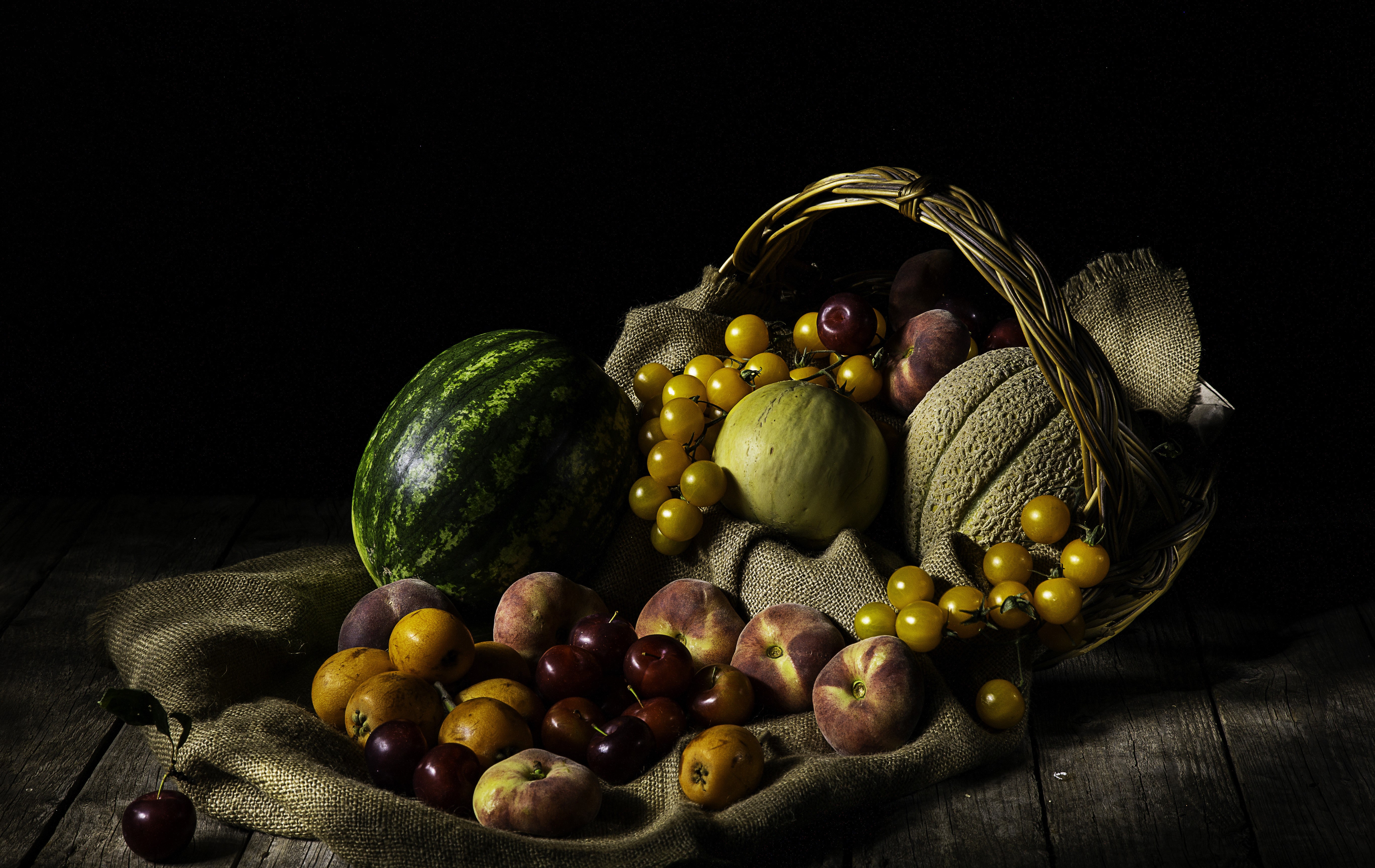 Still-life of fruits in a wicker basket HD Wallpaper