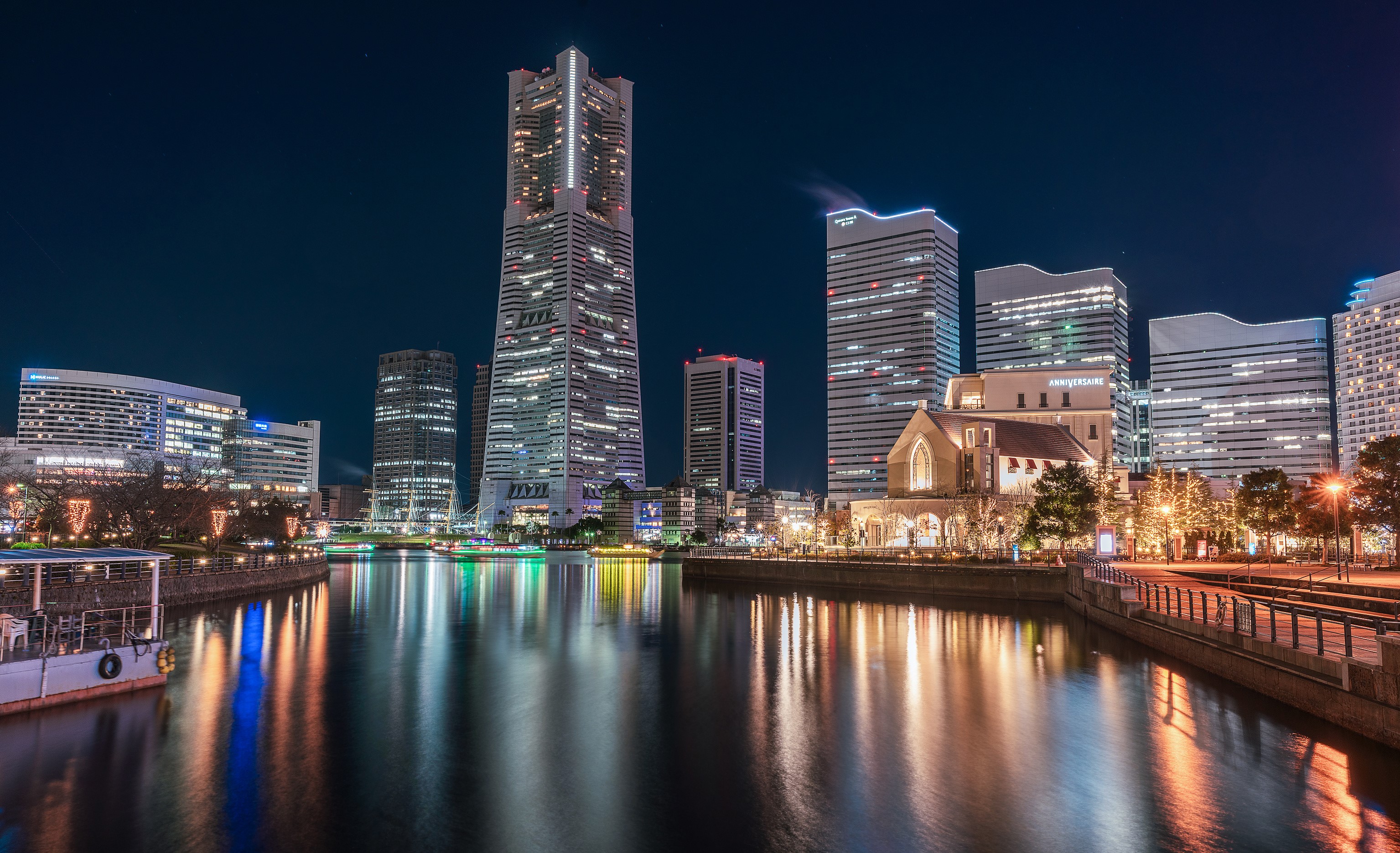 Yokohama skyline at night with waterfront and buildings HD Wallpaper