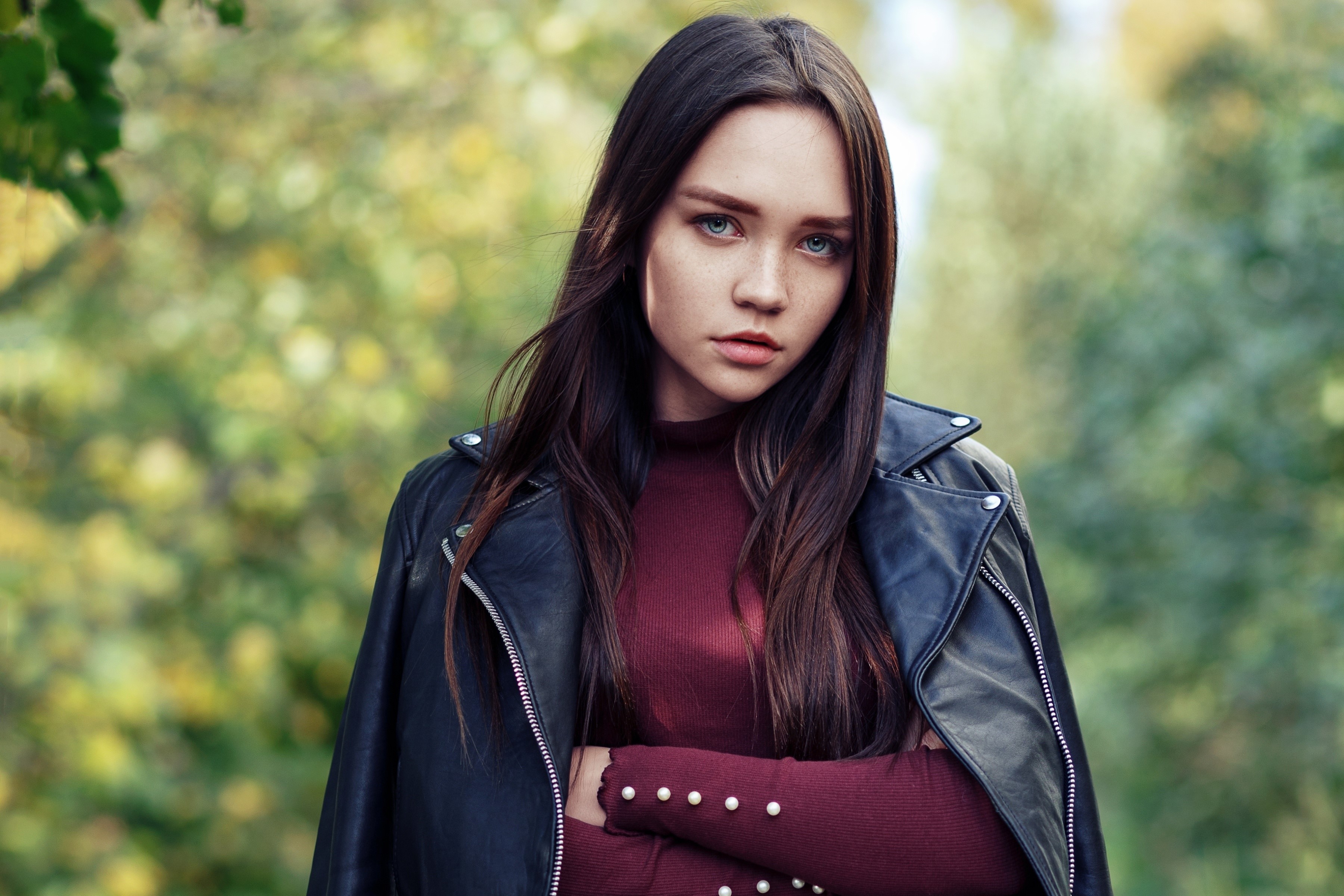 Woman with brown hair wearing a leather jacket HD Wallpaper